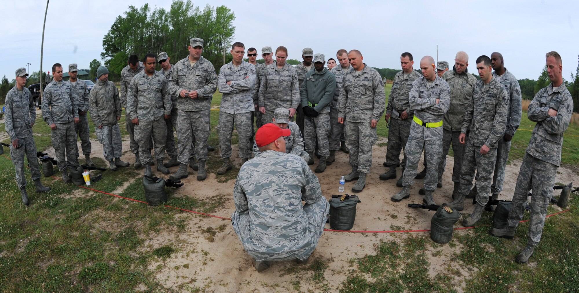 U.S. Air Force Staff Sgt. Tommy Dailey instructs Airmen on how to zero their M4 carbines at Howell Woods Firing Range in Smithfiled, N.C., April 10, 2012. The purpose of zeroing weapons is to increase accuracy and build a better understanding of how the weapon works when firing. Dailey, 4th Security Forces Squadron assistant noncomissioned officer in charge of combat arms, hails from DeSoto, Ill. (U.S. Air Force photo/Airman 1st Class Aubrey Robinson/Released)