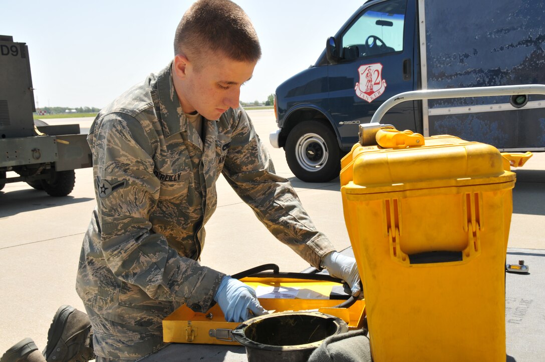 Airman Kevin O'Reilly, a Crew Chief assigned to U.S. Air Force aircraft 80104, a KC-135R Stratotanker, replaces an inline pressure guage after adjusting the nitrogen pressure on a new nose gear tire. Airman O'Reilly, from Laingsburg, Mich., is assigned to the 906th Air Refueling Squadron, an active duty Air Force unit that is associated with the 126th Air Refueling Wing, Illinois National Guard, at Scot AFB, Ill. Crew chiefs perform and oversee everyday maintenance to aircraft. They recover and inspect aircraft after a flight, change tires and brakes, service engine oil and hydraulic fluid, and execute numerous inspections. They ensure an aircraft is safe and reliable. (National Guard photo by Master Sgt. Ken Stephens)