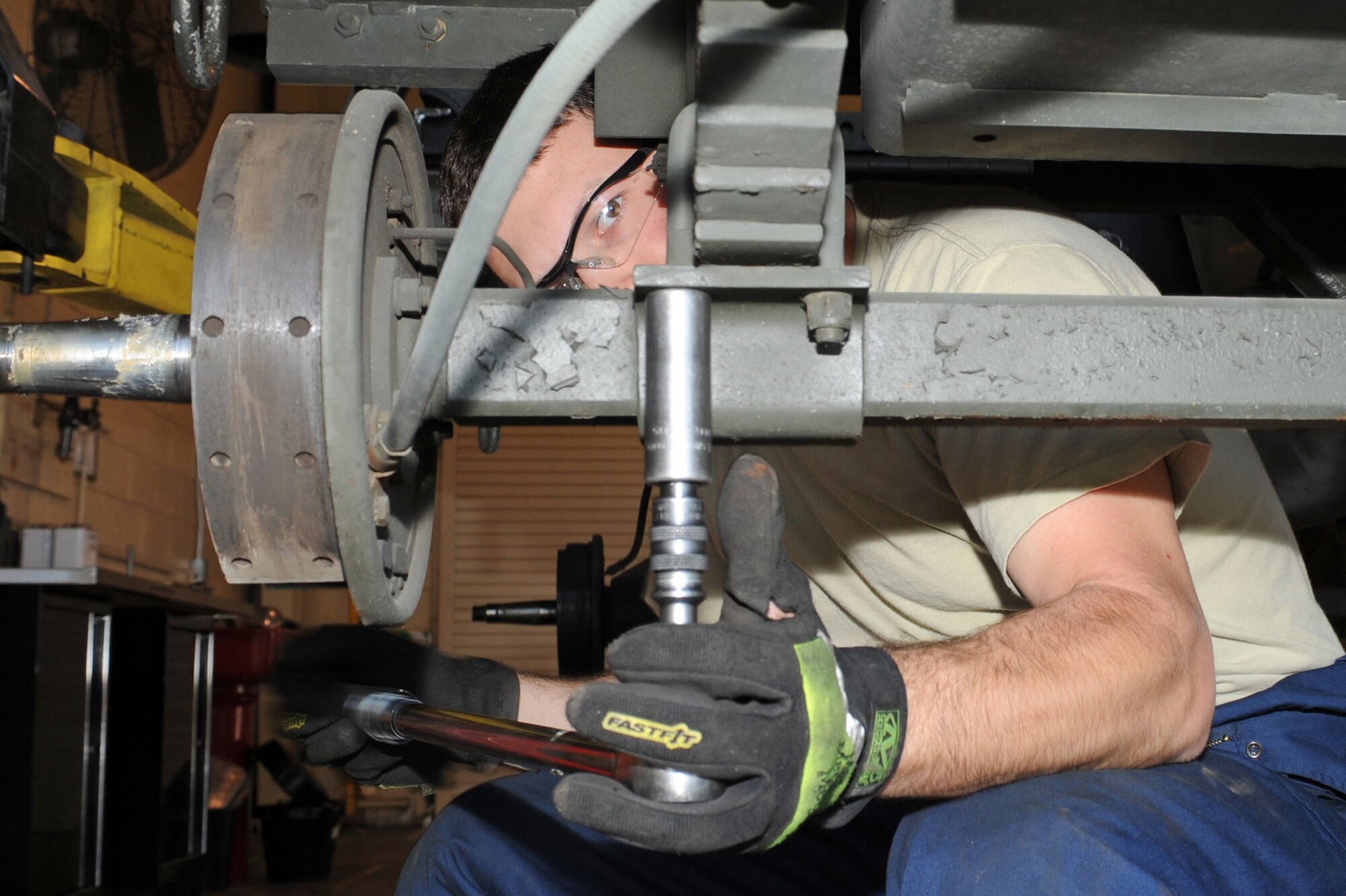 U.S. Air Force Staff Sgt. Nathan Carpenter loosens a bolt on a munitions handling unit 141, a four-wheeled munitions transporter, as part of a routine inspection on Seymour Johnson Air Force Base, N.C., April 9, 2012. During these quality assurance inspections, Carpenter examines the hydraulic systems, brake systems and tires. Carpenter, 4th Equipment Maintenance Squadron equipment maintenance crew chief, is from Corning, N.Y. (U.S. Air Force photo/Airman 1st Class John Nieves Camacho/Released)