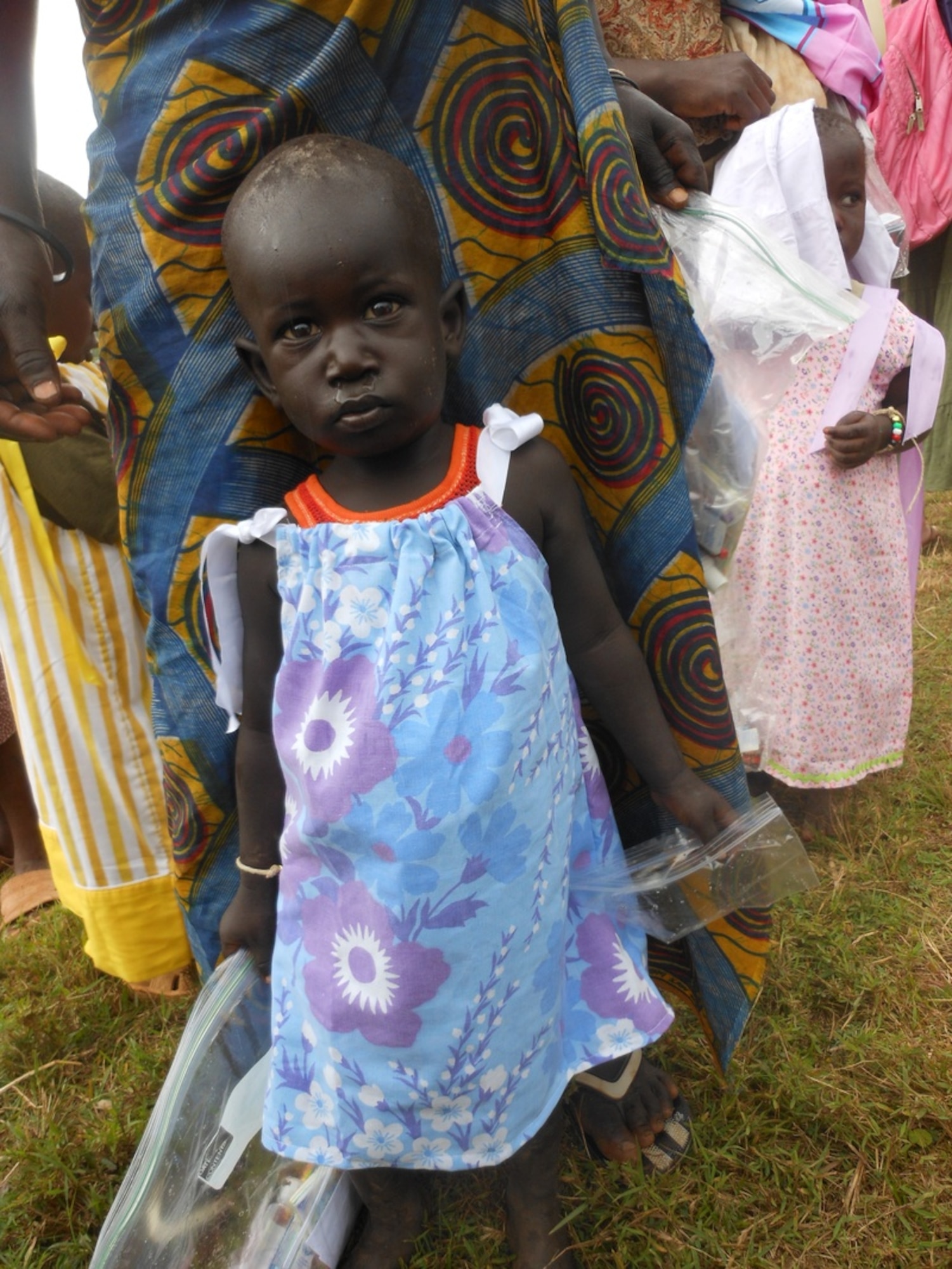 A young girl in Uganda wears pillowcase dress made by U.S. Air Force Master Sgt. Keena Dove-Alston. Dove-Alston sews pillowcase dresses for girls between the ages of 6 months and 11 years in various countries as a part of the Dress a Girl Around the World organization. DAG’s mission is to have a world where every little girl owns at least one dress. Dove-Alston is the 4th Force Support Squadron superintendent of career development and hails from Miami. (Courtesy photo)