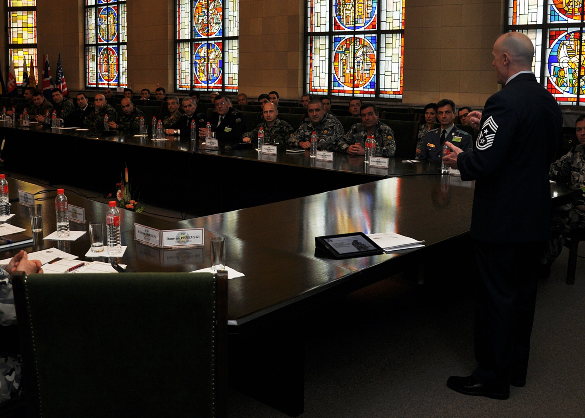 U.S. Air Forces in Europe Command Chief Master Sgt. David Williamson speaks with more than 40 senior leaders during the first Bulgarian and U.S. non-commissioned officer  symposium at the Bulgarian Land Forces headquarters here, April 10-11. Williamson explained the roles and values of U.S. enlisted forces. The senior enlisted leaders met to discuss doctrine, strengths and leadership philosophies, which are designed to empower and inspire non-commissioned officers in both nations' corps. The first day of the joint-nation symposium included four discussions and a small-group breakout session.