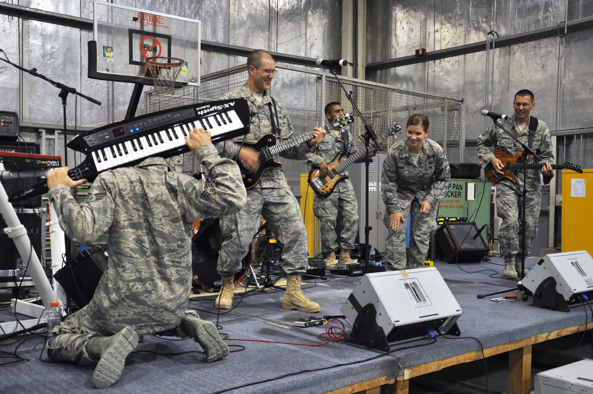 SOUTHWEST ASIA  - Night Wing, the U.S. Air Forces Central Band, performs a song for members of the 380th Air Expeditionary Wing at the aerospace ground equipment hangar April 8, 2012. The band travels throughout the U.S. Central Command area of responsibility to help build partnerships through community performances while also boosting morale for deployed troops. (U.S. Air Force photo/1st Lt. Victoria Porto)