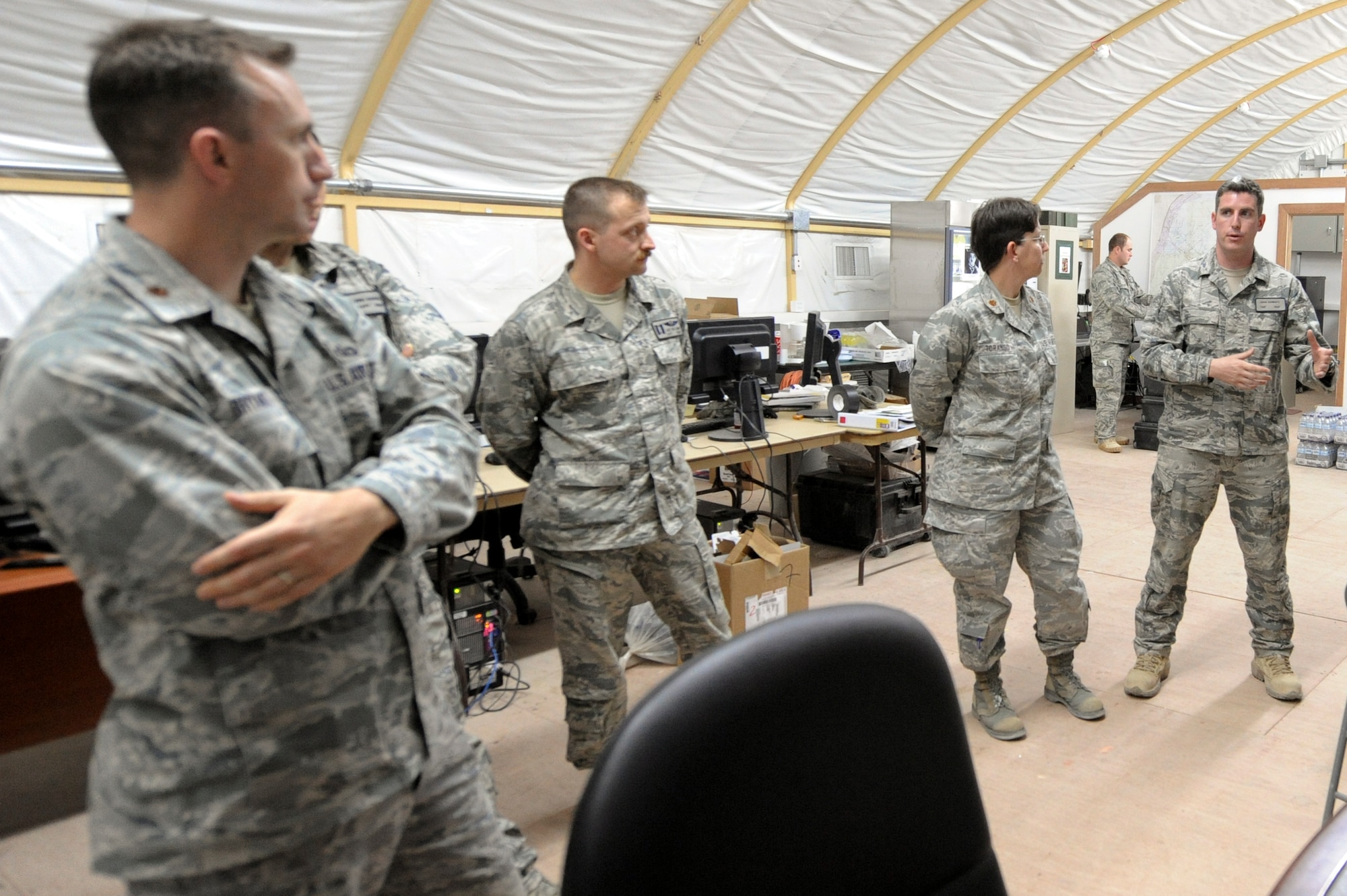 CAMP BUEHRING, KUWAIT -- Airmen from the 332nd Air Expeditionary Wing are briefed by Tech. Sgt. Adam Schwartz, 82nd Expeditionary Air Support Operations Squadron joint terminal air controller, right, about the unit's mission here, April 10, 2012. The 82nd EASOS provide close air support for ground commanders. Schwartz is deployed from Ft. Hood, Texas. (U.S. Air Force photo by Staff Sgt. Joshua J. Garcia)