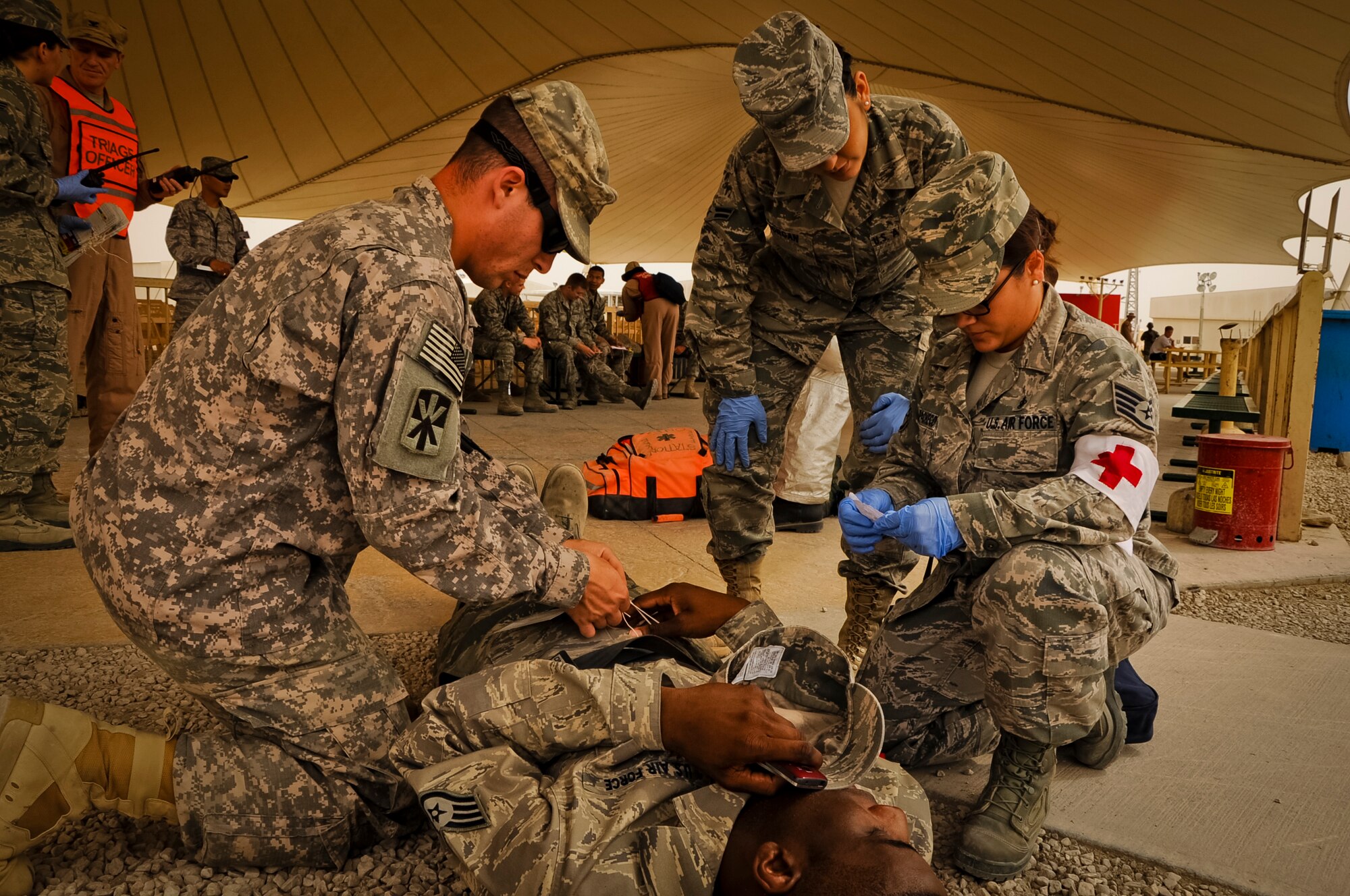 SOUTHWEST ASIA -- First responders treat a simulated blast victim during a mass casualty exercise here April 6, 2012. The base participated in an exercise that simulated an explosion with numerous casualties to test first responder capabilities. (U.S. Air Force photo/Senior Airman Michael Charles)