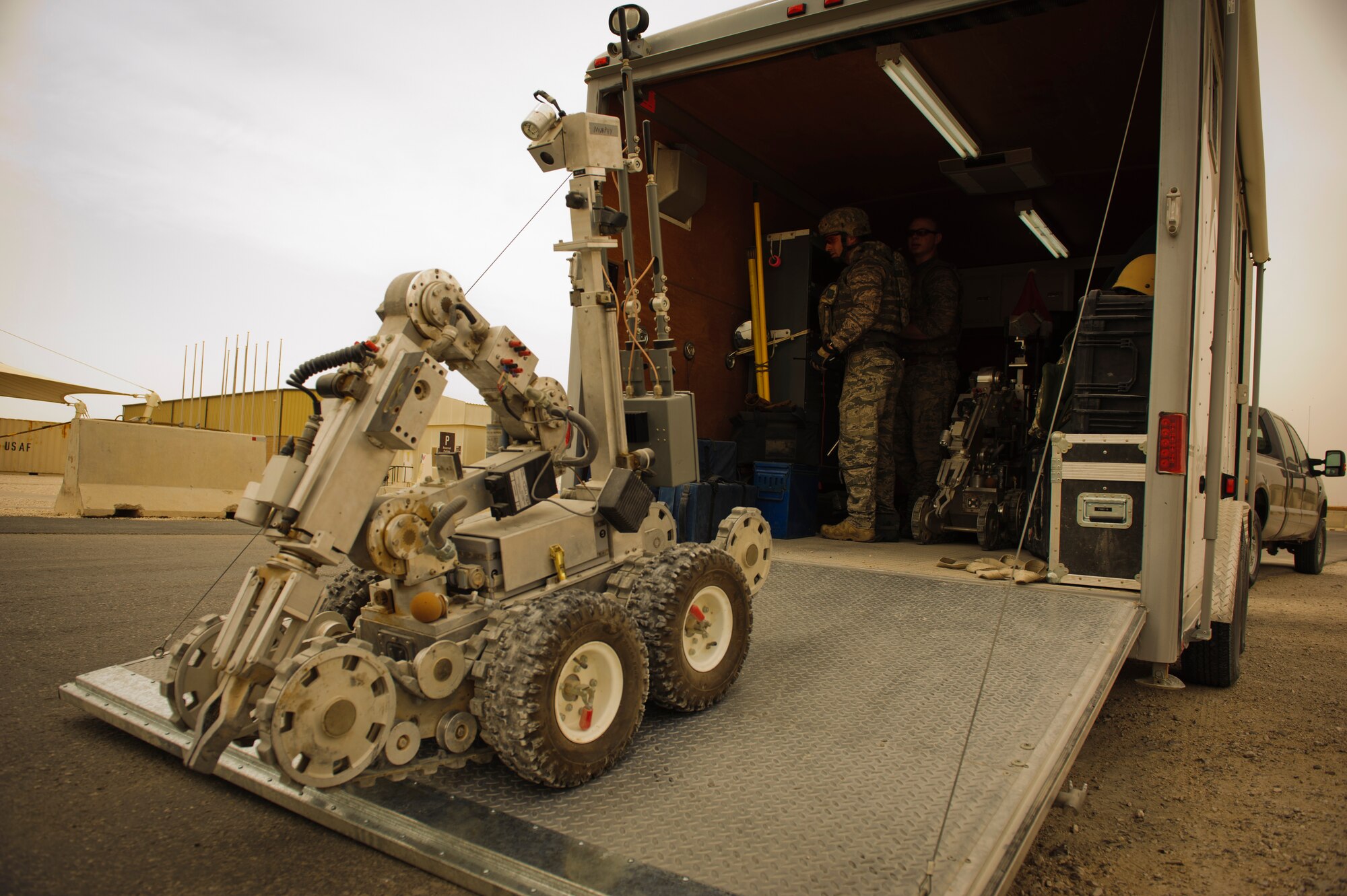 SOUTHWEST ASIA – Explosive ordnance disposal technicians prepare an EOD robot to inspect the scene of a simulated blast site during a mass casualty exercise here April 6, 2012. The base participated in an exercise that simulated an explosion with numerous casualties to test first responder capabilities. (U.S. Air Force photo/Staff Sgt. Nathanael Callon)