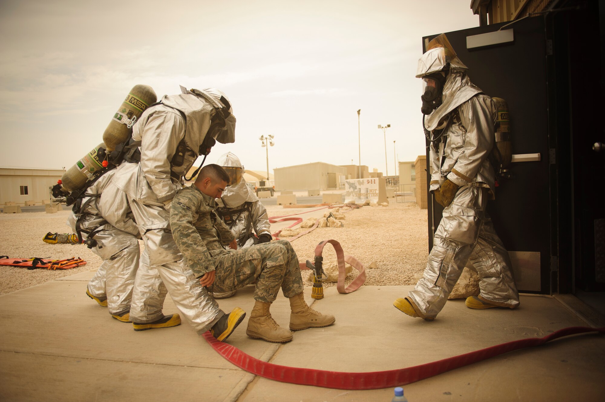 SOUTHWEST ASIA – A firefighter pulls a simulated blast victim from the theater during a mass casualty exercise here April 6, 2012. The base participated in an exercise that simulated an explosion with numerous casualties to test first responder capabilities. (U.S. Air Force photo/Staff Sgt. Nathanael Callon)