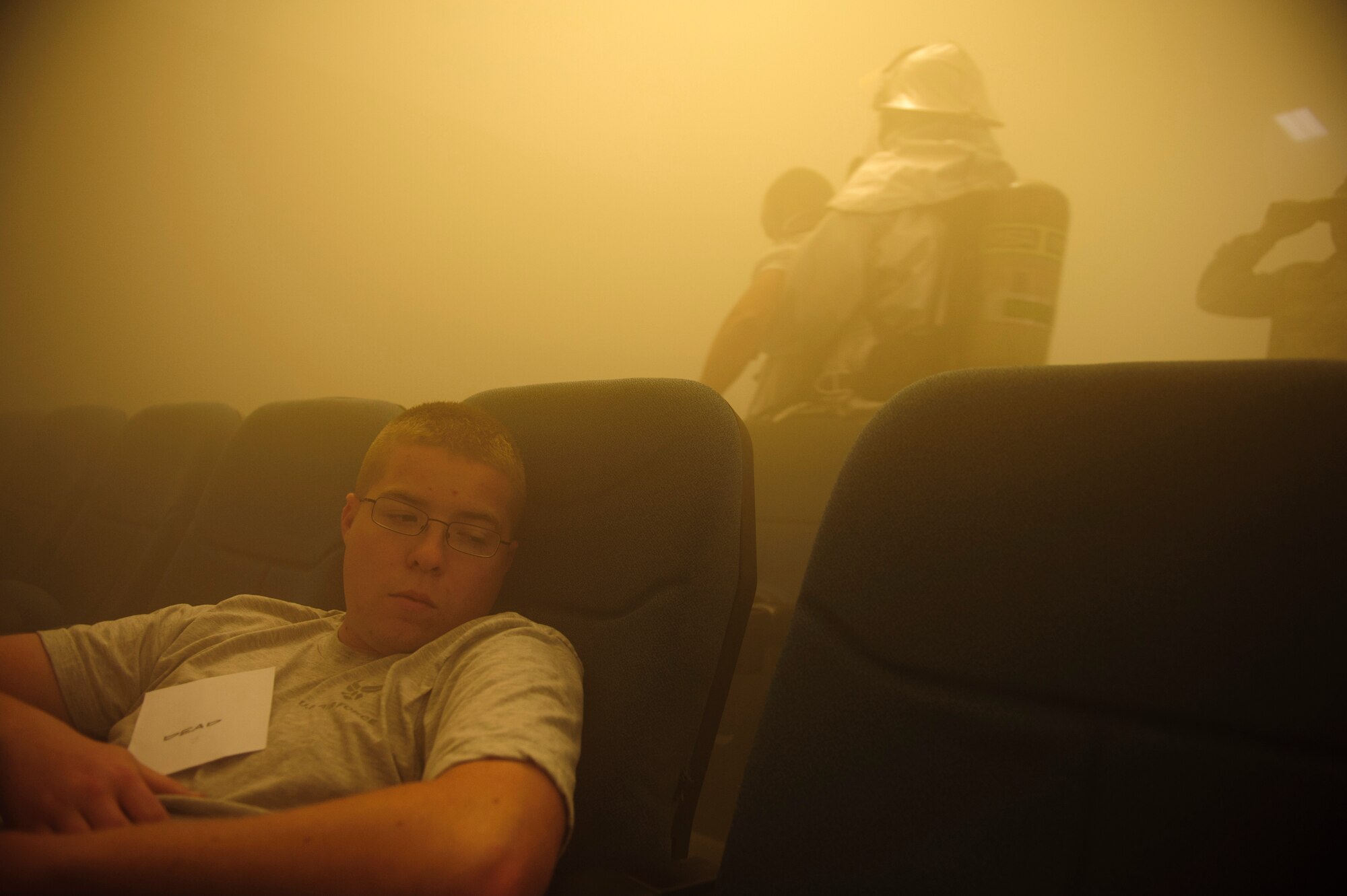 SOUTHWEST ASIA – Senior Airman Christopher Meisenbach, 379th Expeditionary Operations Support Squadron simulated blast victim, waits for firefighters to carry him from the theater during a mass casualty exercise here April 6, 2012. The exercise was created to evaluate first responder capabilities as well as emergency response procedures. (U.S. Air Force photo/Staff Sgt. Nathanael Callon)
