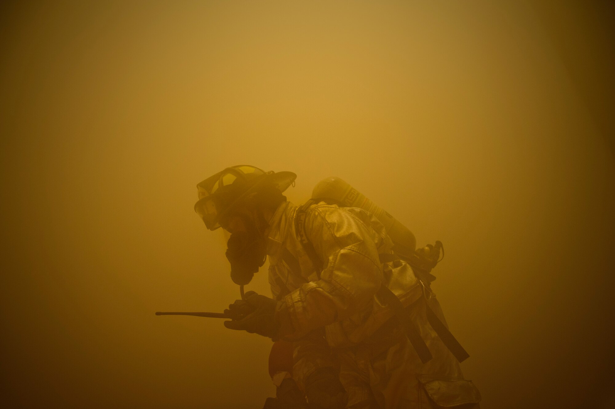 SOUTHWEST ASIA – Tech. Sgt. Todd Raines, 379th Expeditionary Civil Engineer Squadron Fire Department crew chief, searches for the source of a fire in the theater here April 6, 2012. The base participated in an exercise that simulated an explosion with numerous casualties to test first responder capabilities. (U.S. Air Force photo/Staff Sgt. Nathanael Callon)