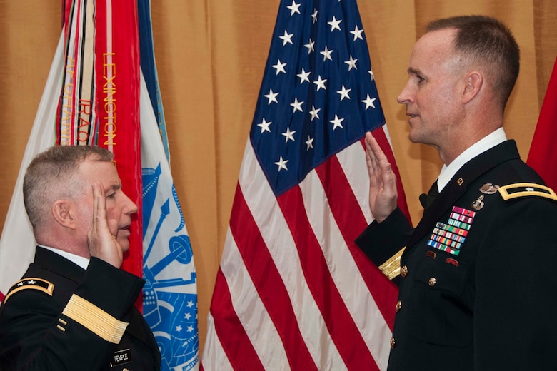 SAN FRANCISCO, Calif. - Maj. Gen. Merdith “Bo” Temple administers the oath to newly promoted Brig. Gen. Michael Wehr (right) March 15.