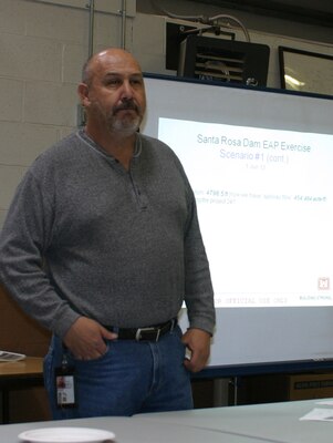 SANTA ROSA, N.M., - Emergency Management Specialist Don Gallegos explained scenarios for discussion during the dam safety exercise to participants. 