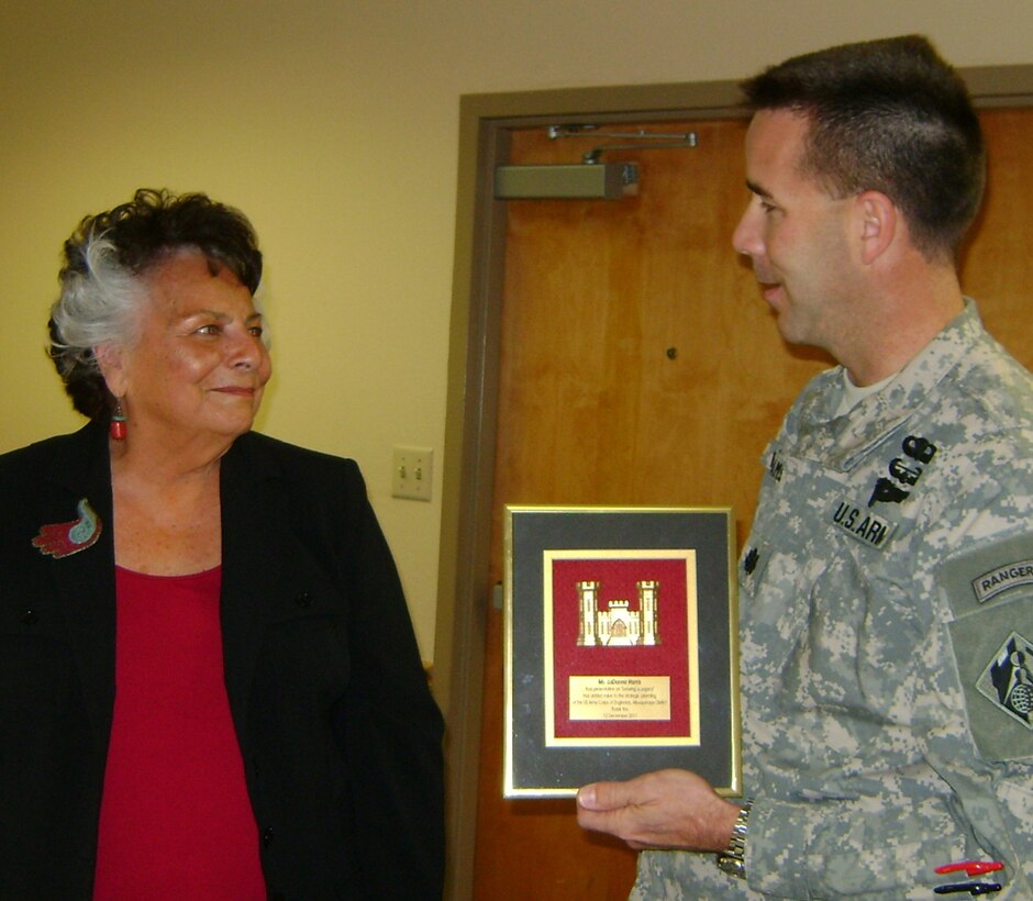 ALBUQUERQUE, N.M., -- District Commander Lt. Col. Jason Williams presents his thanks and a plaque to LaDonna Harris.