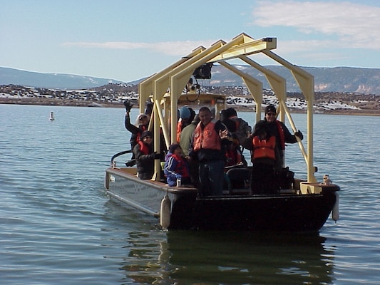 ABIQUIU, N.M., -- Volunteers at the annual Midwinter Eagle Watch look for Bald Eagles from many areas around the project including these volunteers who were on the lake. 17 eagles were spotted this year. 