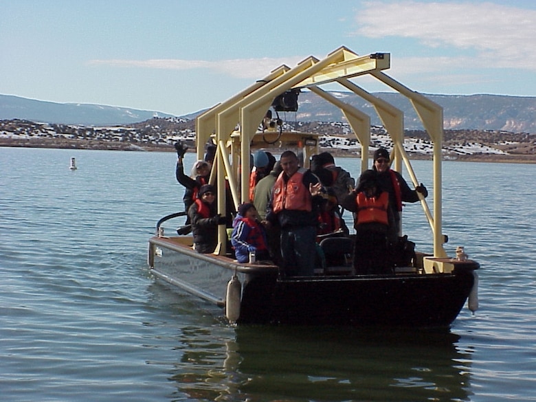 ABIQUIU, N.M., -- Volunteers at the annual Midwinter Eagle Watch look for Bald Eagles from many areas around the project including these volunteers who were on the lake. 17 eagles were spotted this year. 