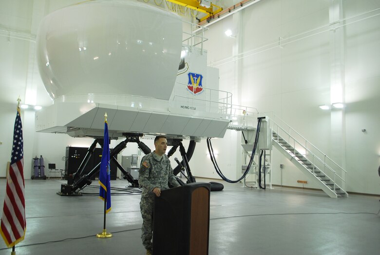 KIRTLAND AIR FORCE BASE, N.M., -- District Commander Lt. Col. Jason Williams addresses officials from Kirtland Air Force Base Jan. 19 at a ribbon-cutting ceremony to celebrate a new addition to a facility that will house HC/MC-130 aircraft simulators.