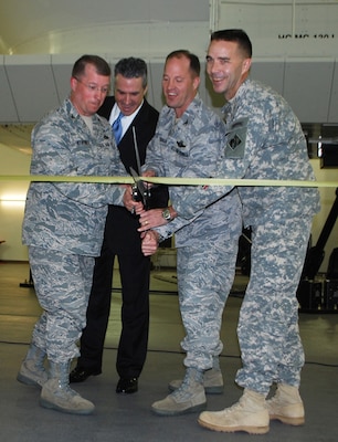 KIRTLAND AIR FORCE BASE, N.M., -- Conducting the ceremony (L to R): Col. James Cardoso, 58th Special Operations Wing Commander; Mr. Tony Frese, Lockheed Martin; Col. John Kubinec, 377 Air Base Wing Commander; Lt. Col. Jason Williams, U.S. Army Corps of Engineers.