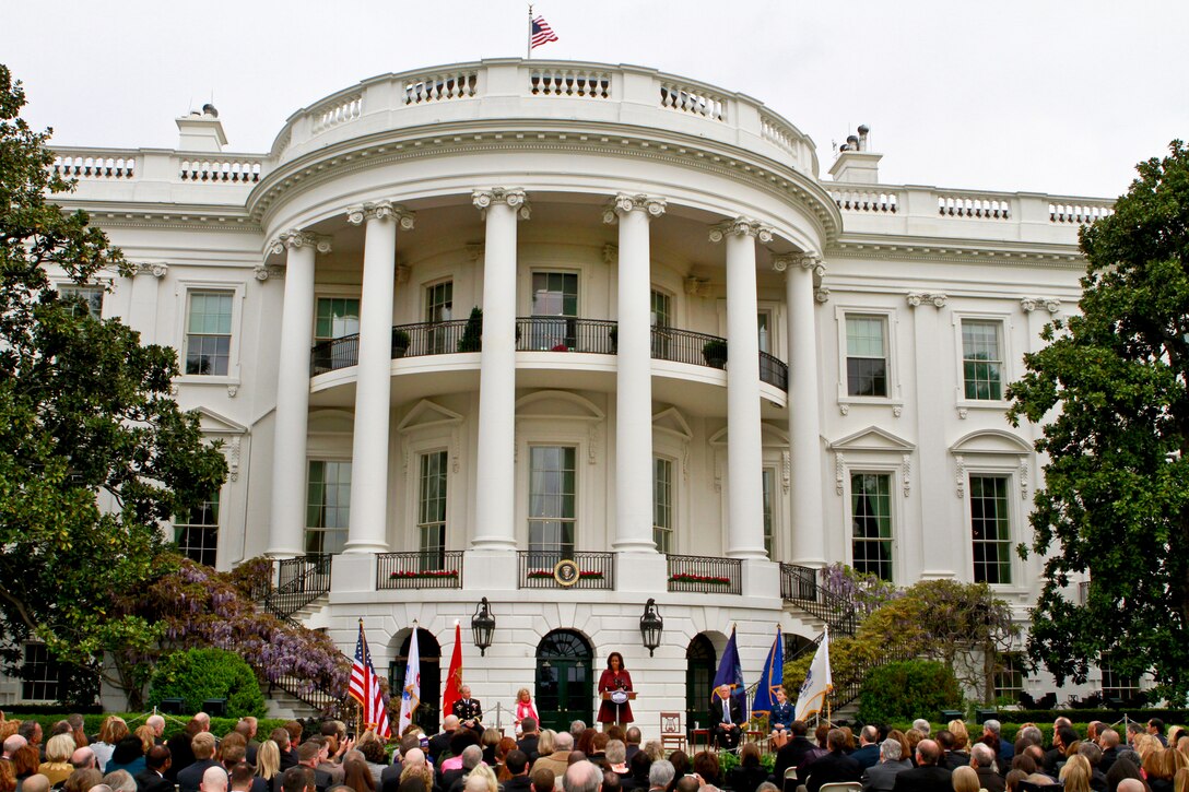 First Lady Michelle Obama describes the accomplishments of the first year of "Joining Forces," a national campaign to support military families, during an event to mark its anniversary at the White House, April 11, 2012. As an example, the First Lady said more than 1,600 businesses had haired more than 50,000 veterans and spouses.