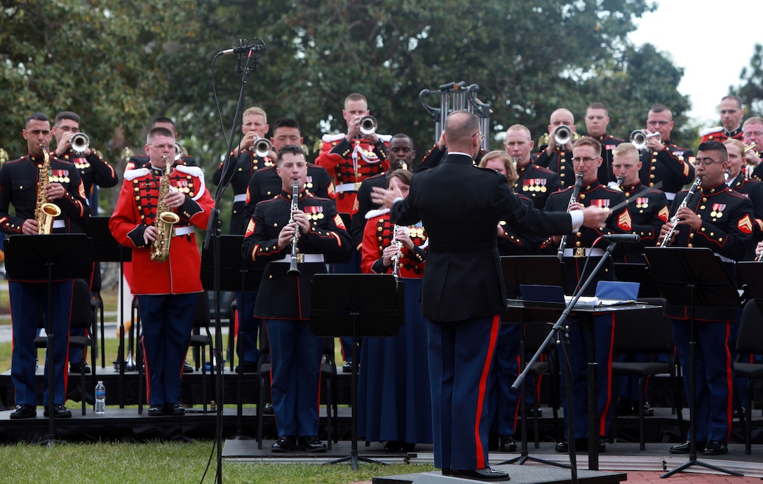 Members of the 2nd Marine Division Band and the United States Marine Band (pictured in red coats), commonly referred to as The President’s Own, play together during a concert April 13.  Members of The President’s Own came from Washington, D.C., to instruct, mentor and play with the 2nd Marine Division Band Marines throughout the week.