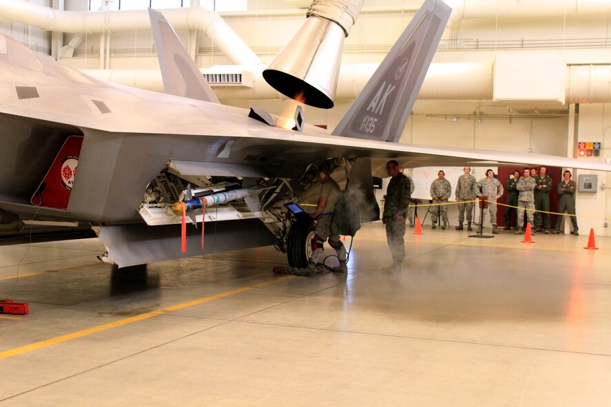 Tech. Sgt. Timothy Tuttle, an Air Reserve Technician with the 477th Aircraft Maintenance Squadron Weapons Flight starts the Auxiliary Power Unit on an F-22 during the 1st Quarter Load Crew Competition. The APU is used to operate the aircrafts weapons bay doors during the loading of the AIM 120 air-to-air missile. Tuttle along with an active duty and a Reserve maintainer make up the three-man team that took first place in the competition.  (U.S. Air Force/Tech. Sgt. Dana Rosso)