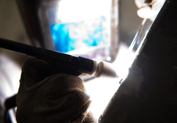 Senior Airman James Chazotte, 28th Maintenance Squadron metals technology technician, welds together a crack on an aerospace ground equipment oil cart in the welding shop at Ellsworth Air Force Base, S.D., April 11, 2012. Aside from minor repairs, metals technology can also fabricate metal parts for various purposes. (U.S. Air Force photo by Airman 1st Class Kate Thornton/Released)