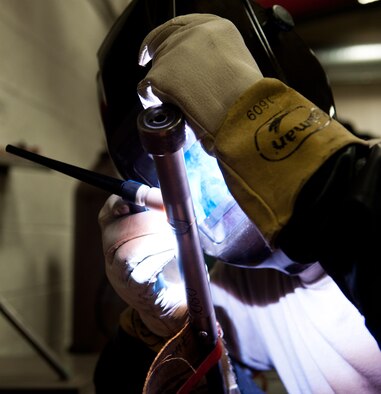 Senior Airman James Chazotte, 28th Maintenance Squadron metals technology technician, welds during upgrade training certification in the welding shop at Ellsworth Air Force Base, S.D., April 11, 2012. Metals technology specialists are trained and certified on several methods of repair, in order to efficiently repair unserviceable items. (U.S. Air Force photo by Airman 1st Class Kate Thornton/Released)