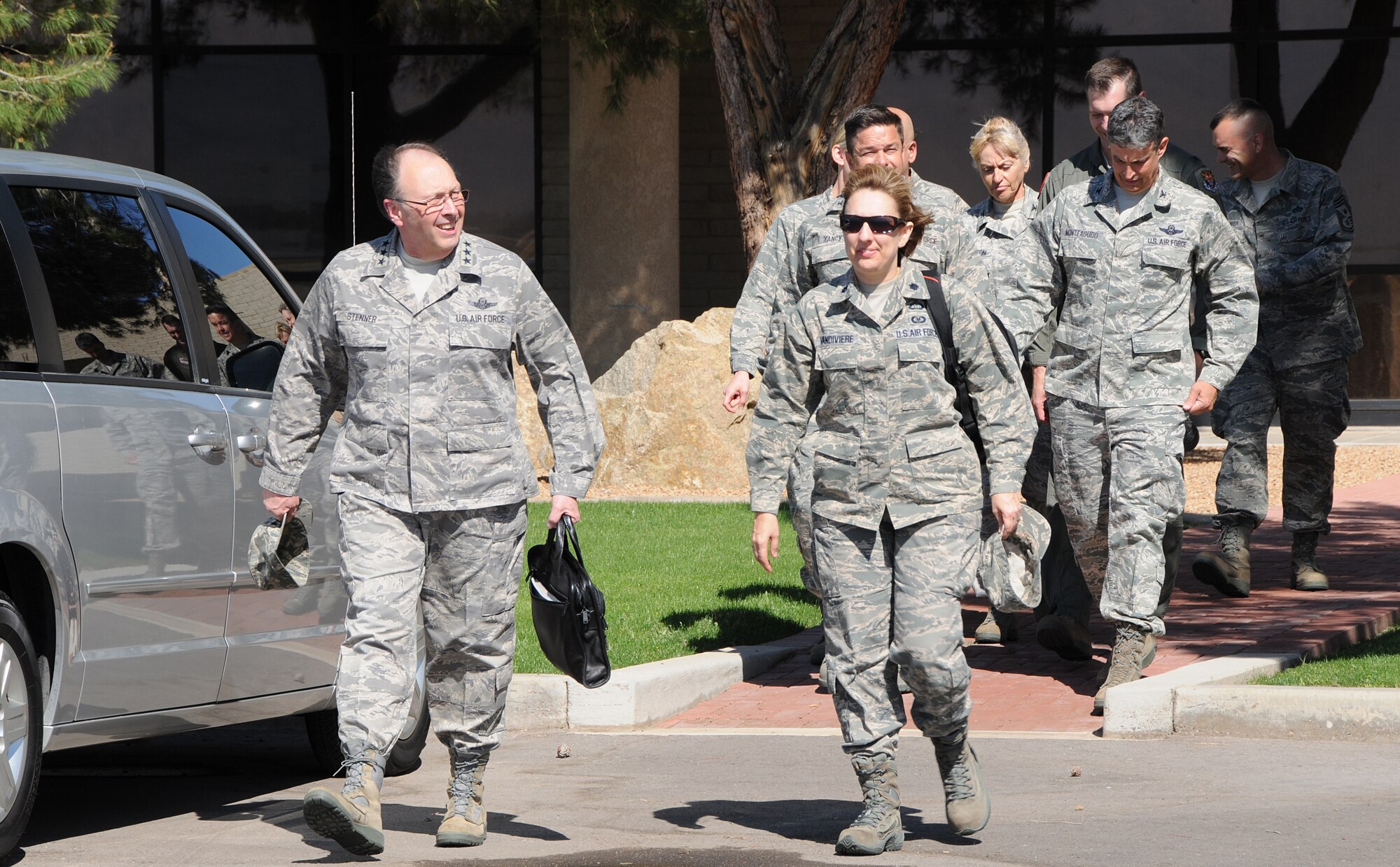 Lt. Gen. Charles Stenner Jr., Air Force Reserve Command commander, and Lt. Col. Sandy Vandiviere, his aide, depart base operations onto the flightline at Luke Air Force Base March 31 after a quick tour and townhall meeting hosted by Col. Jose Monteagudo, 944th Figter Wing commander.  (U.S. Air Force photo by Staff Sgt. Louis Vega Jr)