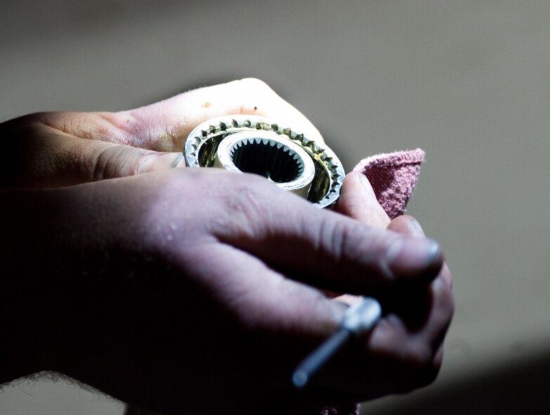 Staff Sgt. Eric Smith, 28th Maintenance Squadron repair and reclamation technician, greases a wing sweep drive shaft during an isochronal inspection at Ellsworth Air Force Base, S.D., April 10, 2012. The wing sweep drive shaft allows the wings on a B-1 to sweep back during high subsonic and supersonic flight. (U.S. Air Force photo by Airman 1st Class Alystria Maurer/Released)