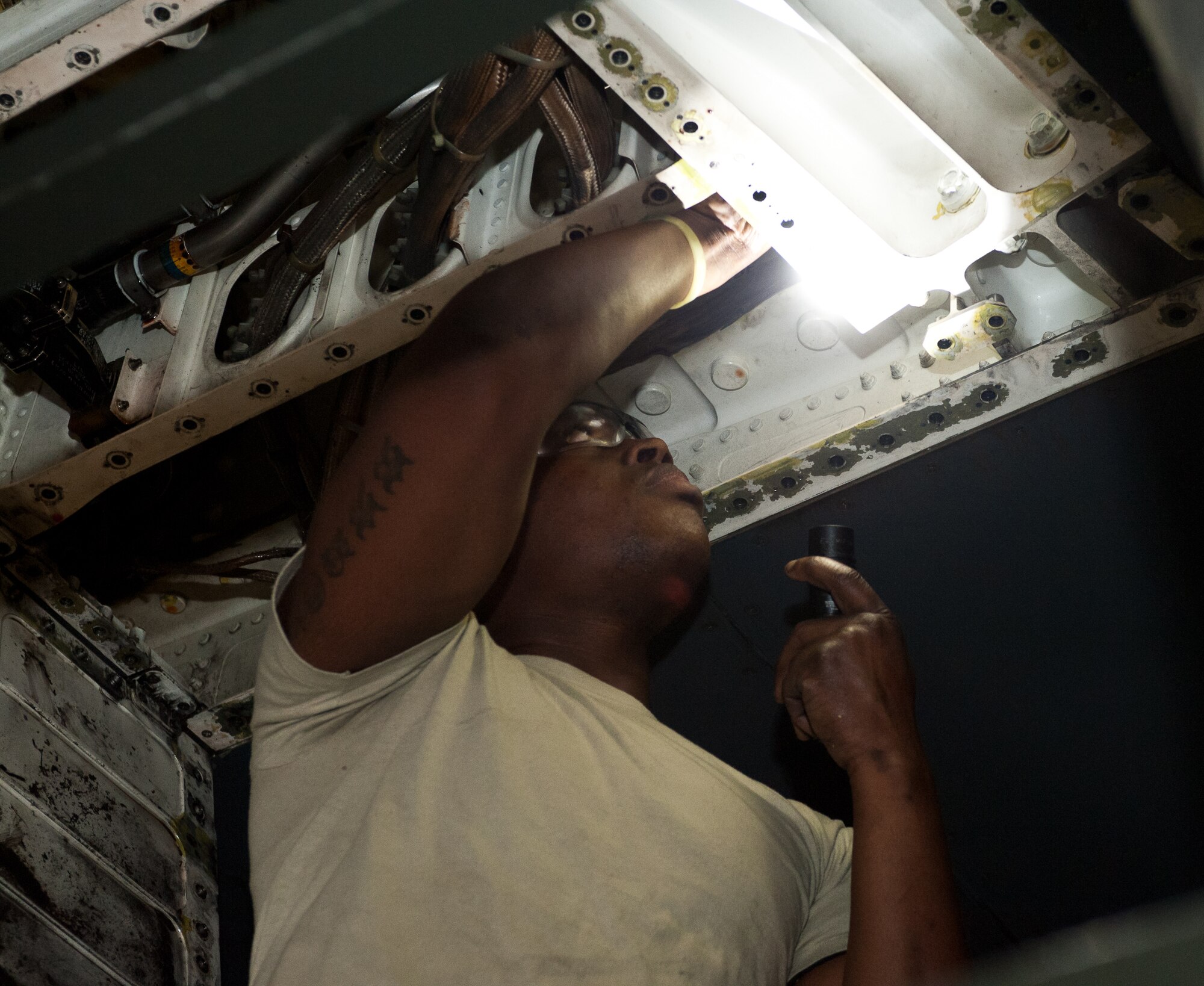 Senior Airman Samuel Carr, 28th Maintenance Squadron repair and reclamation technician, removes a flap slat torque tube limiter during an isochronal inspection at Ellsworth Air Force Base, S.D., April 10, 2012. This system monitors the amount of torque in the flat slat, and the inspection ensures that flaps don’t lock up during flight. (U.S. Air Force photo by Airman 1st Class Alystria Maurer/Released)