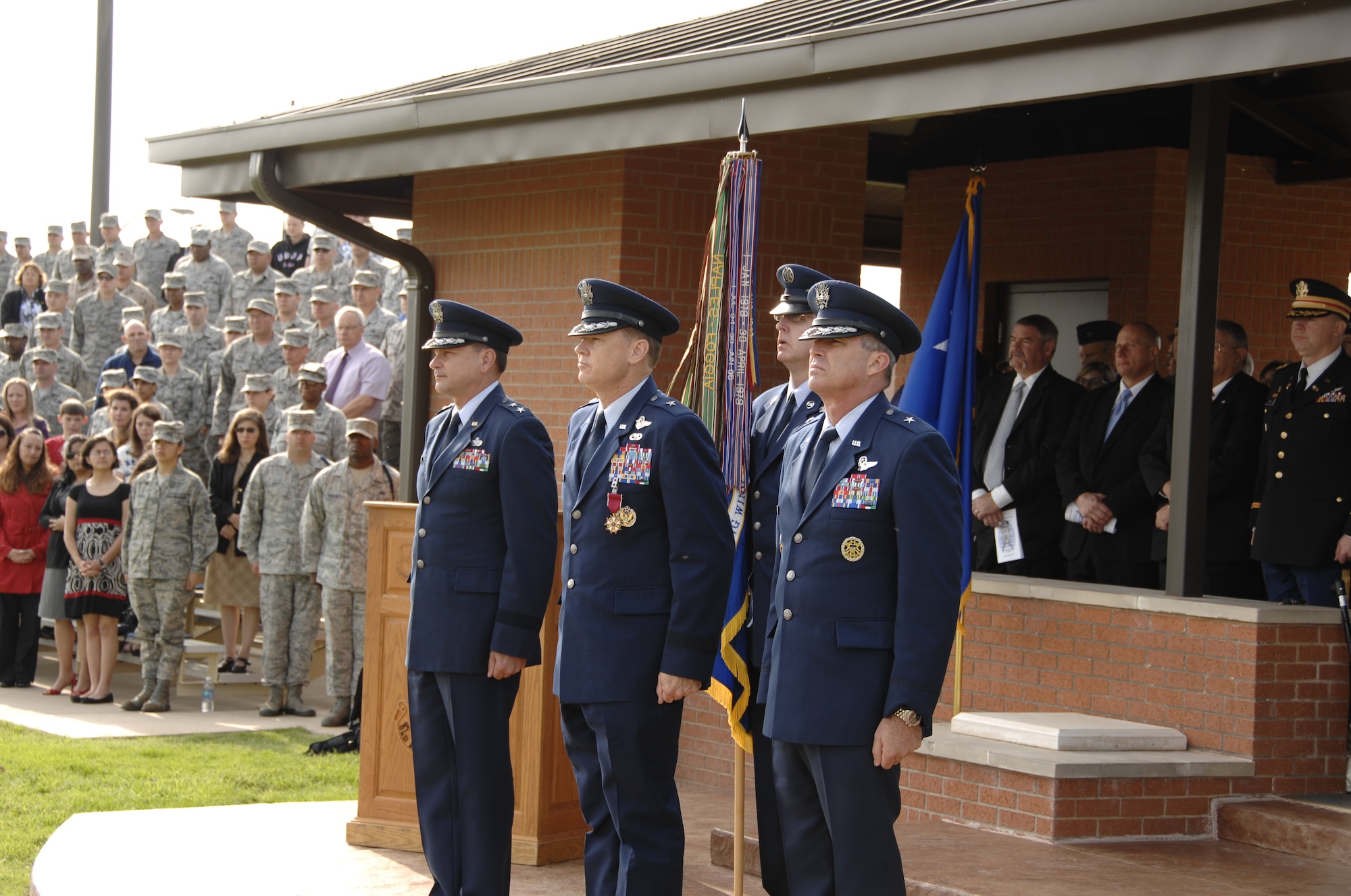 Maj. Gen. Leonard A. "Len" Patrick (left), Brig. Gen. Darryl W. Burke (center) and Brig. Gen. Michael A. Fantini (right) getting ready to officially change command.
