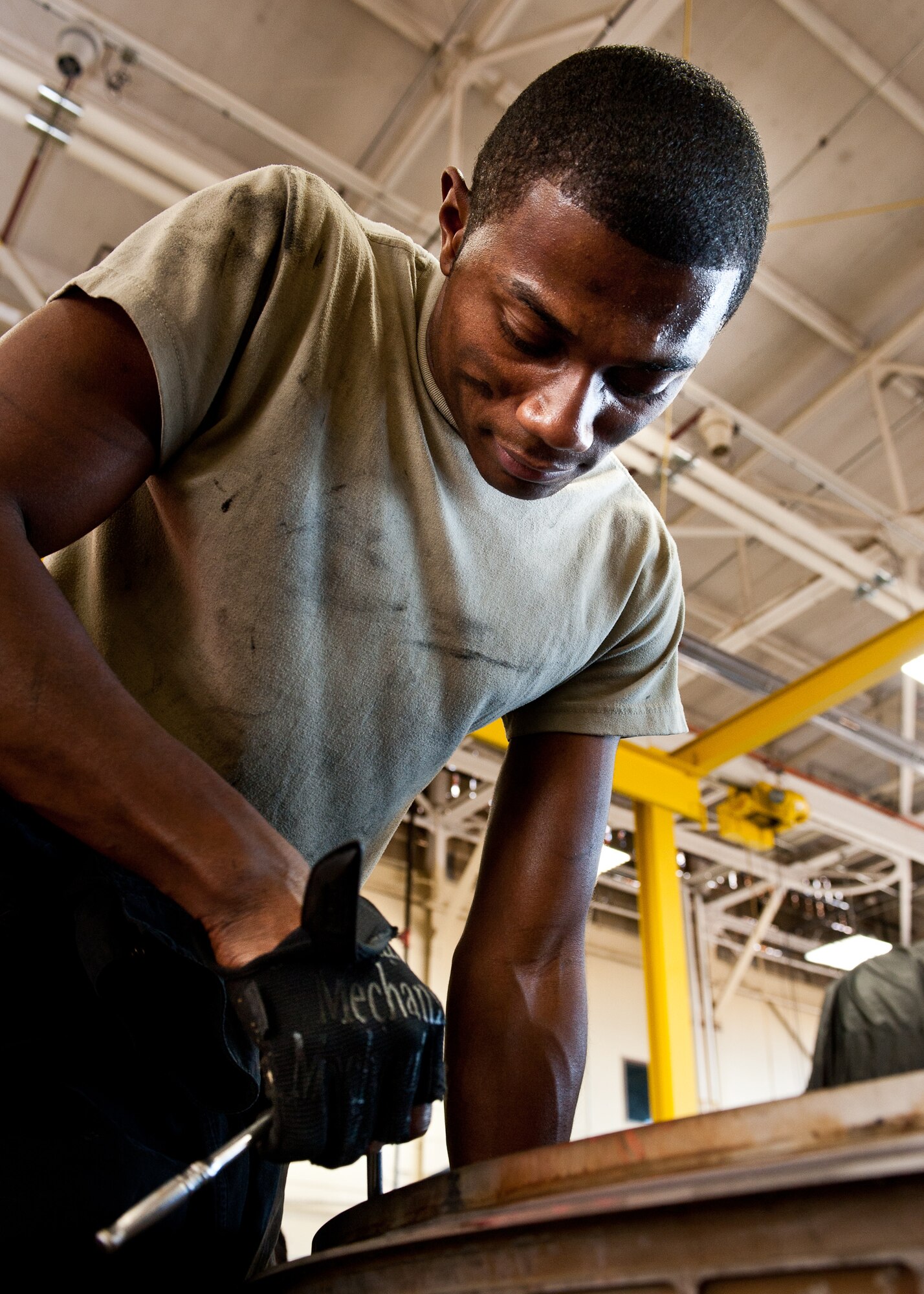 Senior Airman Kymric Walker, 28th Maintenance Squadron aerospace propulsion technician, takes apart the mixing duct on a B-1 engine during routine maintenance at Ellsworth Air Force Base, S.D., March 21, 2012. The mixing duct was deemed unserviceable during an engine inspection. (U.S. Air Force photo by Airman 1st Class Alystria Maurer/Released)