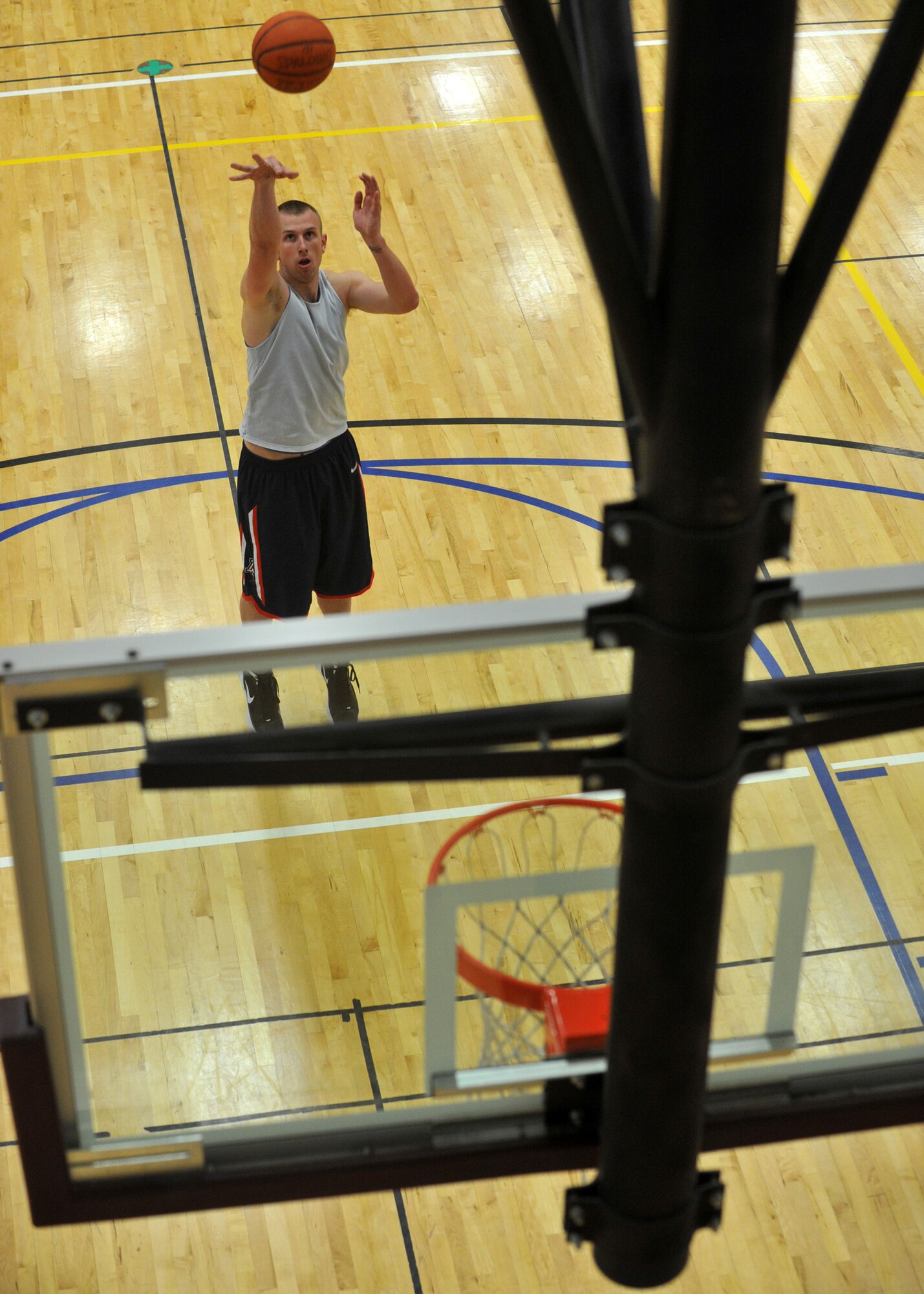 BUCKLEY AIR FORCE BASE, Colo. -- Brandon Wyatt, 566th Intelligence Squadron contractor intramural basketball team, shoots a shot at the free throw line during the last minutes of the game, Buckley Fitness Center, April 6, 2012. Wyatt started in the starting lineup and finished the game with a total of 24 points. (U.S. Air Force photo by Airman 1st Class Darryl L Bolden Jr.)
