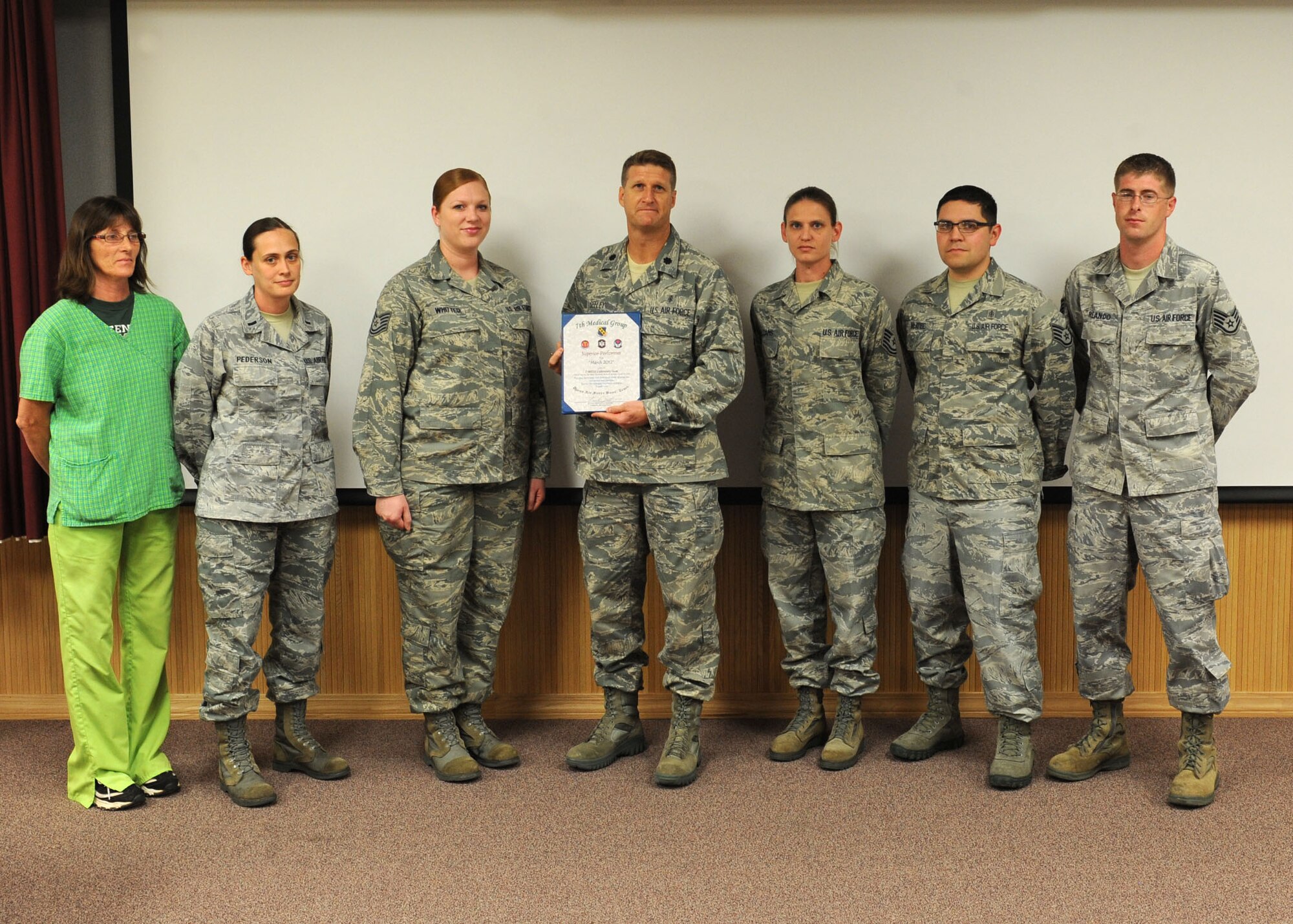Members from the 7th Medical Support Squadron’s laboratory team receive the 7th Medical Group’s superior performer of the month award from Lt. Col. Kevin Seeley, 7th Medical Support Squadron commander April 12, 2012, at Dyess Air Force Base, Texas. The team maintains the mobile bio-medical lab and precision equipment as well as recently completing an inspection by the College of American Pathology. (U.S. Air Force photo by Airman 1st Class Peter Thompson/ Released)  