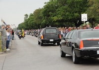 Joint Base San Antonio members salute the hearse carrying the body of Seaman
Trevor J. Stanley, of Virginia Beach, Va., April 13 at JBSA-Randolph.
Stanley was assigned to Naval Mobile Construction Battalion 3, Port Hueneme,
Calif. The motorcade exited Randolph for funeral services at Colonial
Funeral Home in Universal City. Stanley's family resides in the area. 
(U.S. Air Force photo by Melissa Peterson)