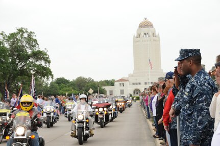 Joint Base San Antonio members pay respect as the motorcade escorts the body of Seaman Trevor J. Stanley, of Virginia Beach, Va., April 13 at JBSA-Randolph. Stanley was assigned to Naval Mobile Construction Battalion 3, Port Hueneme, Calif. The motorcade exited Randolph for funeral services at Colonial Funeral Home in Universal City. Stanley's family resides in the area. 
(U.S. Air Force photo by Melissa Peterson)