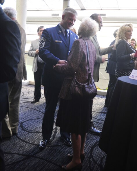 Chief Master Sgt. Gordon Drake, 62nd Airlift Wing command chief, introduces himself to members of the Tacoma-Pierce County Chamber of Commerce April 12, 2012, at Hotel Murano in Tacoma, Wash. The chamber hosted an Air Force Commanders Reception to introduce Col. Wyn Elder, 62nd AW commander, Col. Bruce Bowers, 446th Airlift Wing commander, and Col. Peter Stavros, Western Air Defense Sector commander, to the local community. (U.S. Air Force photo/Staff Sgt. Frances Kriss) 