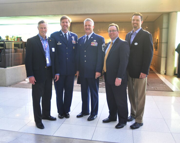 Col. Wyn Elder (second left), 62nd Airlift Wing commander, and Chief Master Sgt. Gordon Drake (center), 62nd AW command chief, are welcomed by members of the Tacoma-Pierce County Chamber of Commerce April 12, 2012, at Hotel Murano in Tacoma, Wash. The chamber hosted an Air Force Commanders Reception to introduce Colonel Elder, Col. Bruce Bowers, 446th Airlift Wing commander, and Col. Peter Stavros, Western Air Defense Sector commander, to the local community. (U.S. Air Force photo/Staff Sgt. Frances Kriss) 