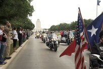 Joint Base San Antonio members pay respect as the motorcade escorts the body of Seaman Trevor J. Stanley, of Virginia Beach, Va., April 13 at JBSA-Randolph. Stanley was assigned to Naval Mobile Construction Battalion 3, Port Hueneme, Calif. The motorcade exited Randolph for funeral services at Colonial Funeral Home in Universal City. Stanley's family resides in the area. (U.S. Air Force photo/Rich McFadden) 