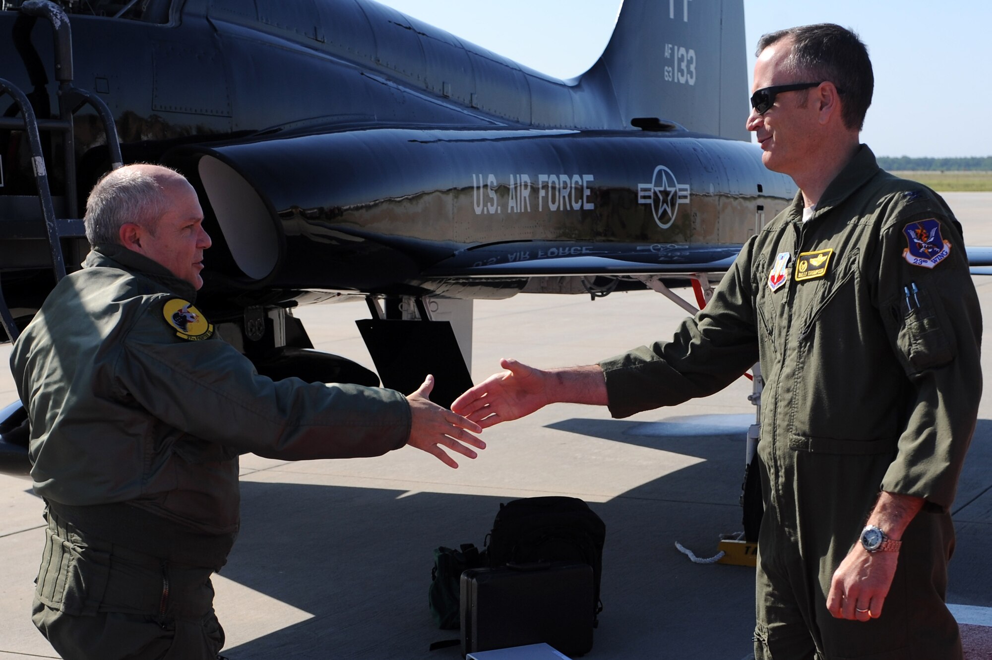 U.S. Air Force Col. Billy Thompson, 23d Wing commander greets Maj. Gen Charles Lyon, Headquarters Air Combat Command director of operations, at Moody Air Force Base, Ga., April 12, 2012. During his visit, Lyon gained knowledge of Moody’s mission and received a tour of different squadrons on base. (U.S. Air Force photo by Staff Sgt. Ciara Wymbs/Released)