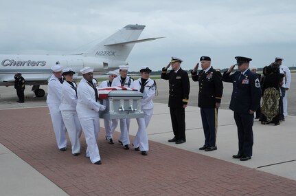A U.S. Navy carry team transfers the body of Seaman Trevor J. Stanley, of Virginia Beach, Va., past Joint Base San Antonio leaders April 13 at JBSA-Randolph. Stanley was assigned to Naval Mobile Construction Battalion 3, Port Hueneme, Calif. The motorcade exited Randolph for funeral services at Colonial Funeral Home in Universal City. Stanley's family resides in the area. (U.S. Air Force photo by Joel Martinez)
