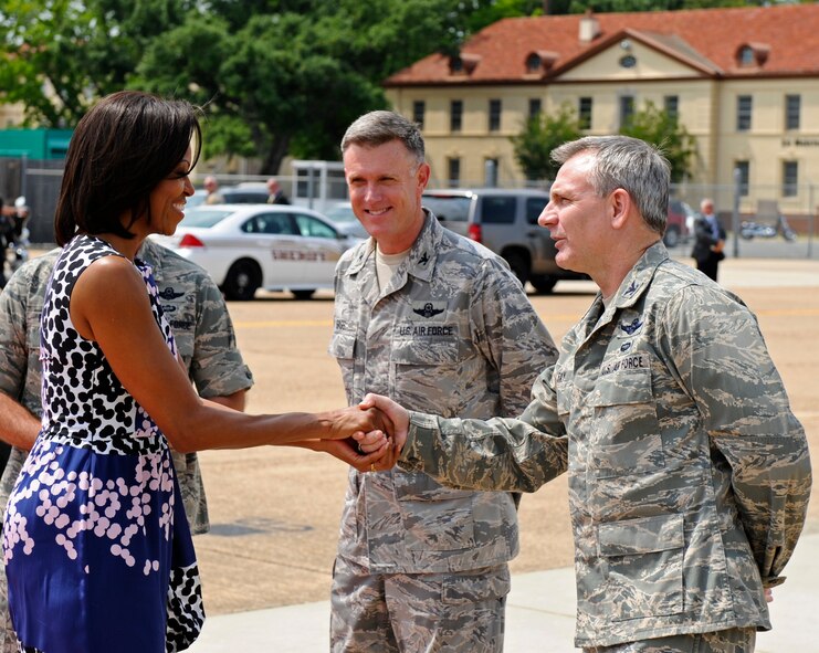 Col. Tim Fay, 2nd Bomb Wing commander, shakes Michelle Obama's hand on Barksdale Air Force Base, La., April 12. The First Lady passed through Barksdale on her way to a local event to celebrate the first anniversary of the Joining Forces Campaign. The campaign was established to encourage employers to hire military veterans and their spouses. (U.S. Air Force photo/Airman 1st Class Micaiah Anthony)(RELEASED)