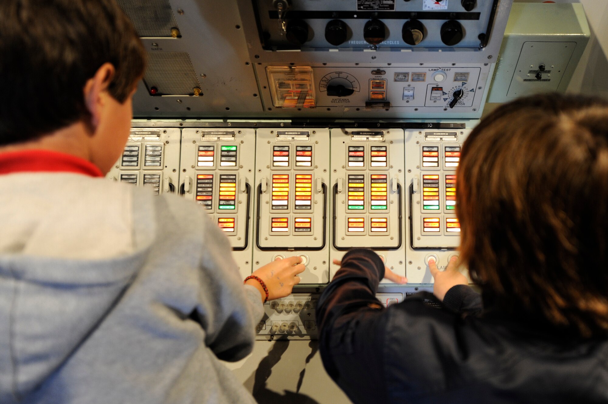 VANDENBERG AIR FORCE BASE, Calif. -- Children on the base public tour play with a deactivated launch control console at the Heritage Museum on base during the public tour here Wednesday, April 11, 2012. Base tours are scheduled for the second Wednesday of every month.To participate in a tour visit www.vandenberg.af.mil and click on the "Public Tour Application" link. (U.S. Air Force photo/Staff Sgt. Andrew Satran) 

 
