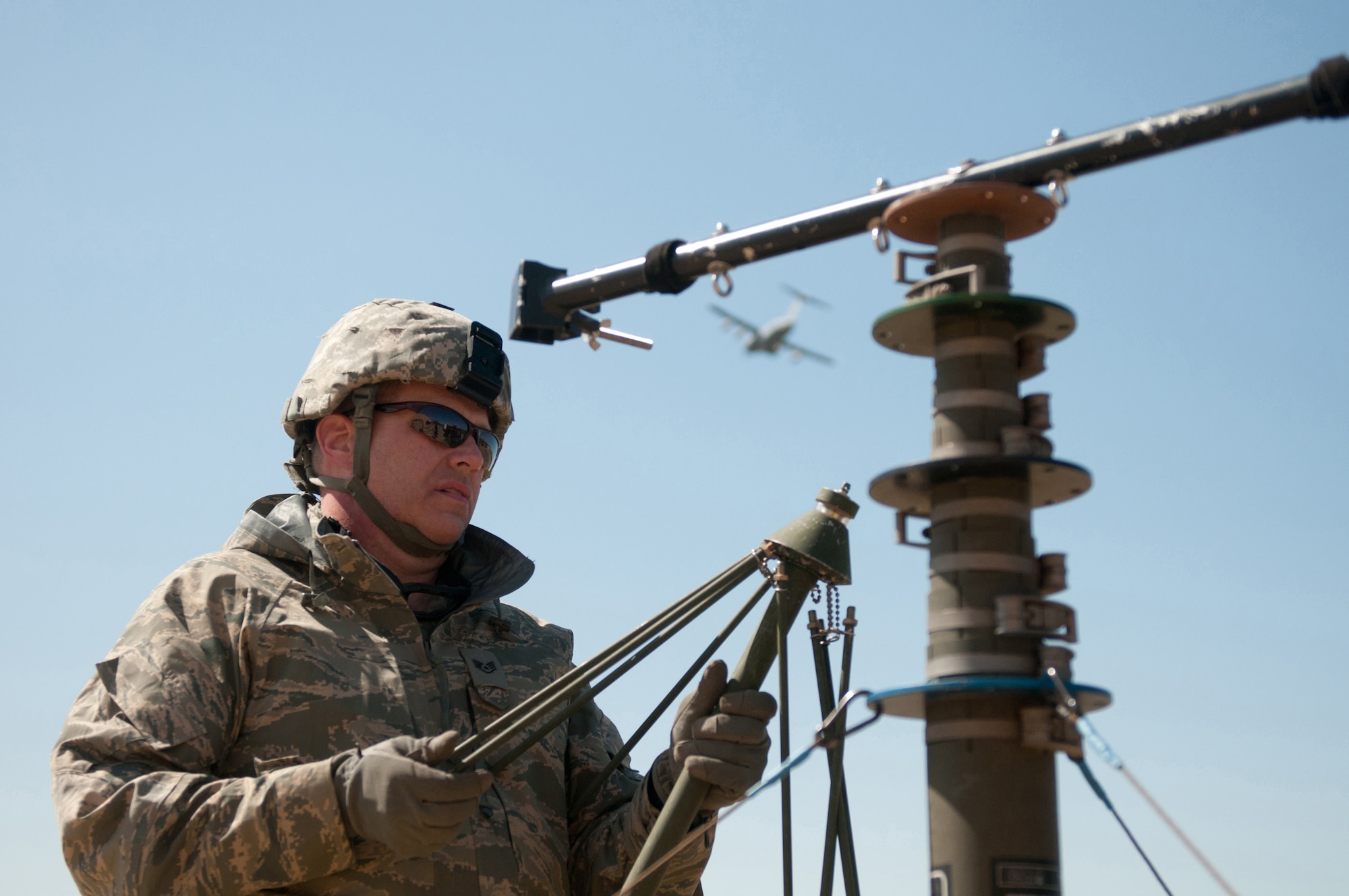 Staff Sgt. Michael Railey, a communication specialist in the Kentucky Air National Guard's123rd Contingency Response Group, assembles an antenna group at Joint Base McGuire-Dix-Lakehurst, N.J., on March 27, 2012. Railey was participating in a U.S. Transportation Command exercise designed to test the Kentucky unit’s ability to establish a Joint Task Force-Port Opening within 24 hours of arrival. (U.S. Air Force photo by Master Sgt. Phil Speck)
