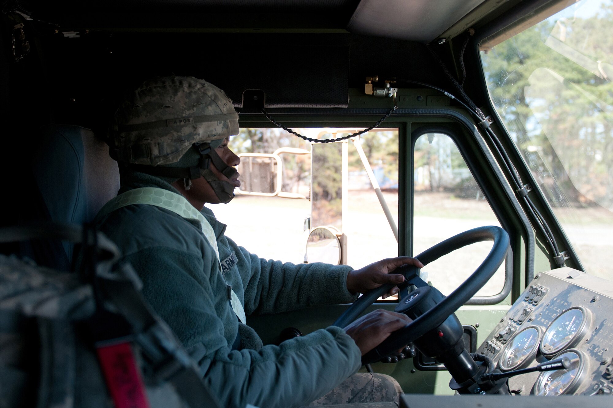 Army Sgt. Billy Artis, a transporter from the 690th Rapid Port Opening Element, drives cargo from the marshaling yard at Lakehurst Naval Air Engineering Station, N.J., to a forward distribution node during Exercise Eagle Flag March 27, 2012. The Kentucky Air National Guard's 123rd Contingency Response Group from Louisville, Ky., and the 690th from Fort Eustis, Va., joined forces for the exercise to form a Joint Task Force-Port Opening. (U.S. Air Force photo by Master Sgt. Phil Speck)