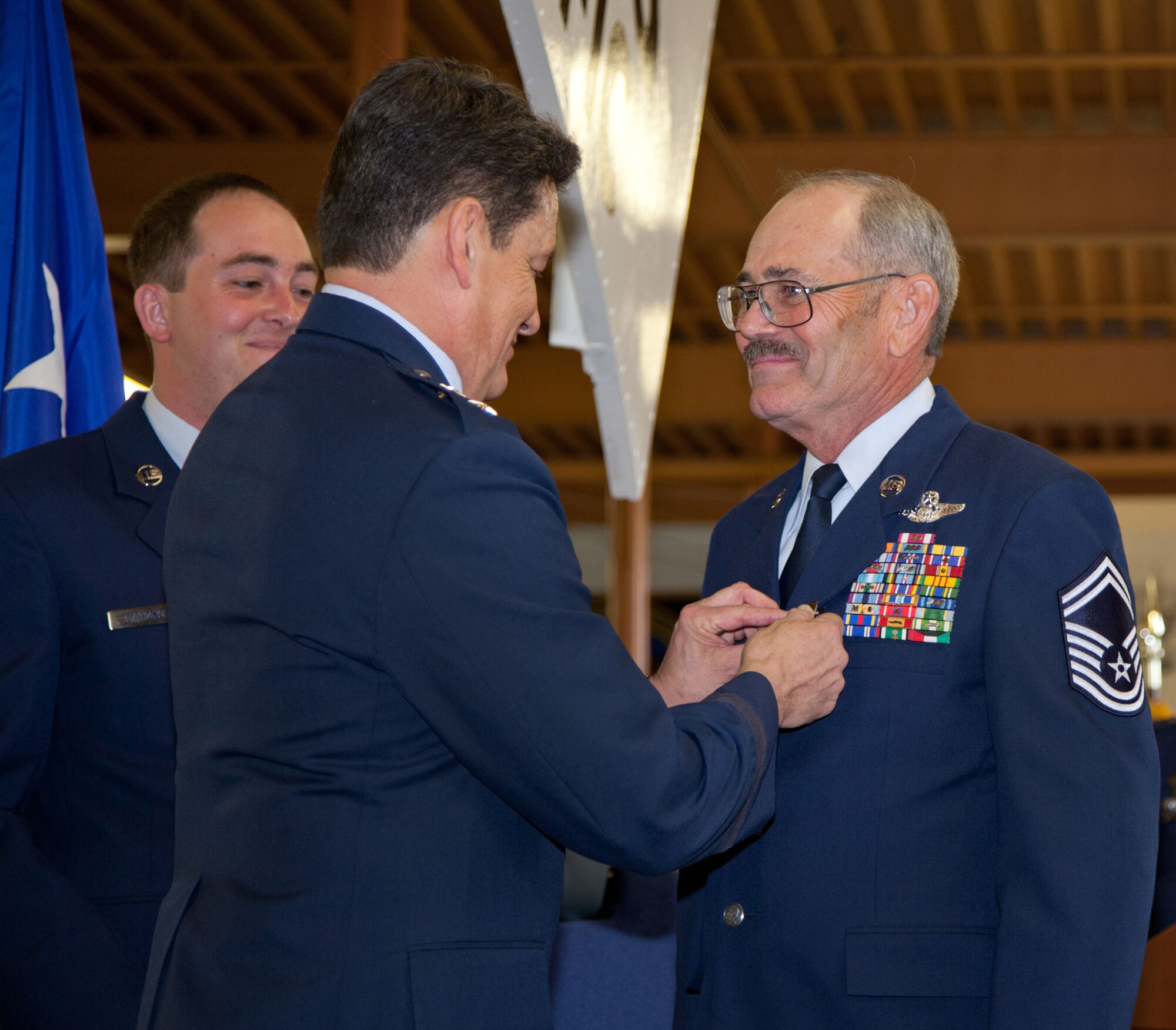 TRAVIS AIR FORCE BASE, Calif. -- Family and friends of Senior Master Sgt. David Raymond celebrate his 40 years of service in the U.S. Air Force Reserve at a retirement ceremony at Travis Air Force Base, Calif., April 11, 2012. Maj. Gen. Frank J. Padilla, Deputy Inspector General of the Air Force, presided over the ceremony honoring Raymond’s legacy as a C-5 Galaxy flight engineer with the 312th Airlift Squadron, 349th Air Mobility Wing.  Raymond began his military career as a C-141 loadmaster at Travis AFB during the Vietnam War. (U.S. Air Force photo / Lt. Col. Robert Couse-Baker)
