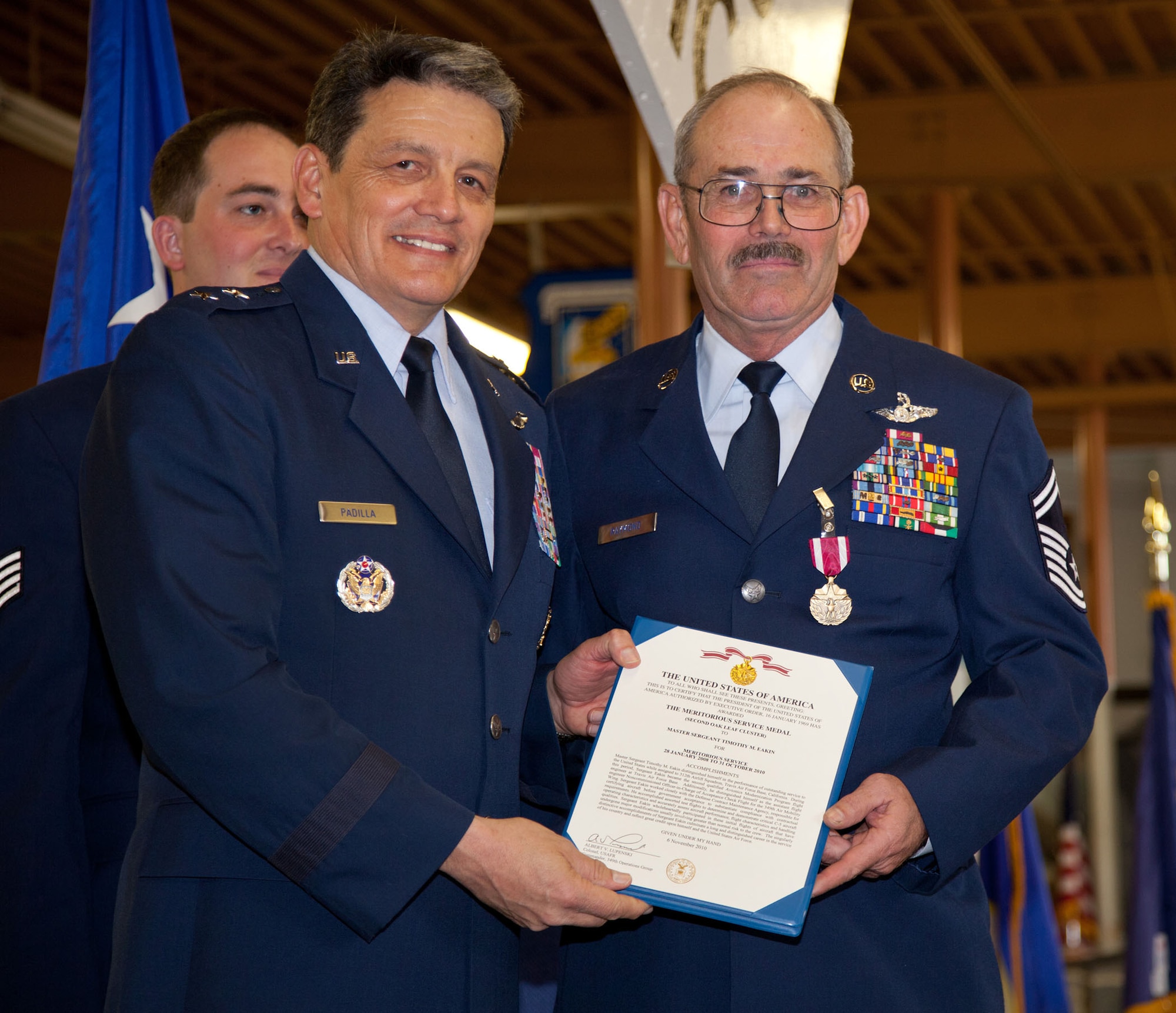 TRAVIS AIR FORCE BASE, Calif. -- Family and friends of Senior Master Sgt. David Raymond celebrate his 40 years of service in the U.S. Air Force Reserve at a retirement ceremony at Travis Air Force Base, Calif., April 11, 2012. Maj. Gen. Frank J. Padilla, Deputy Inspector General of the Air Force, presided over the ceremony honoring Raymond’s legacy as a C-5 Galaxy flight engineer with the 312th Airlift Squadron, 349th Air Mobility Wing.  Raymond began his military career as a C-141 loadmaster at Travis AFB during the Vietnam War. (U.S. Air Force photo / Lt. Col. Robert Couse-Baker)
