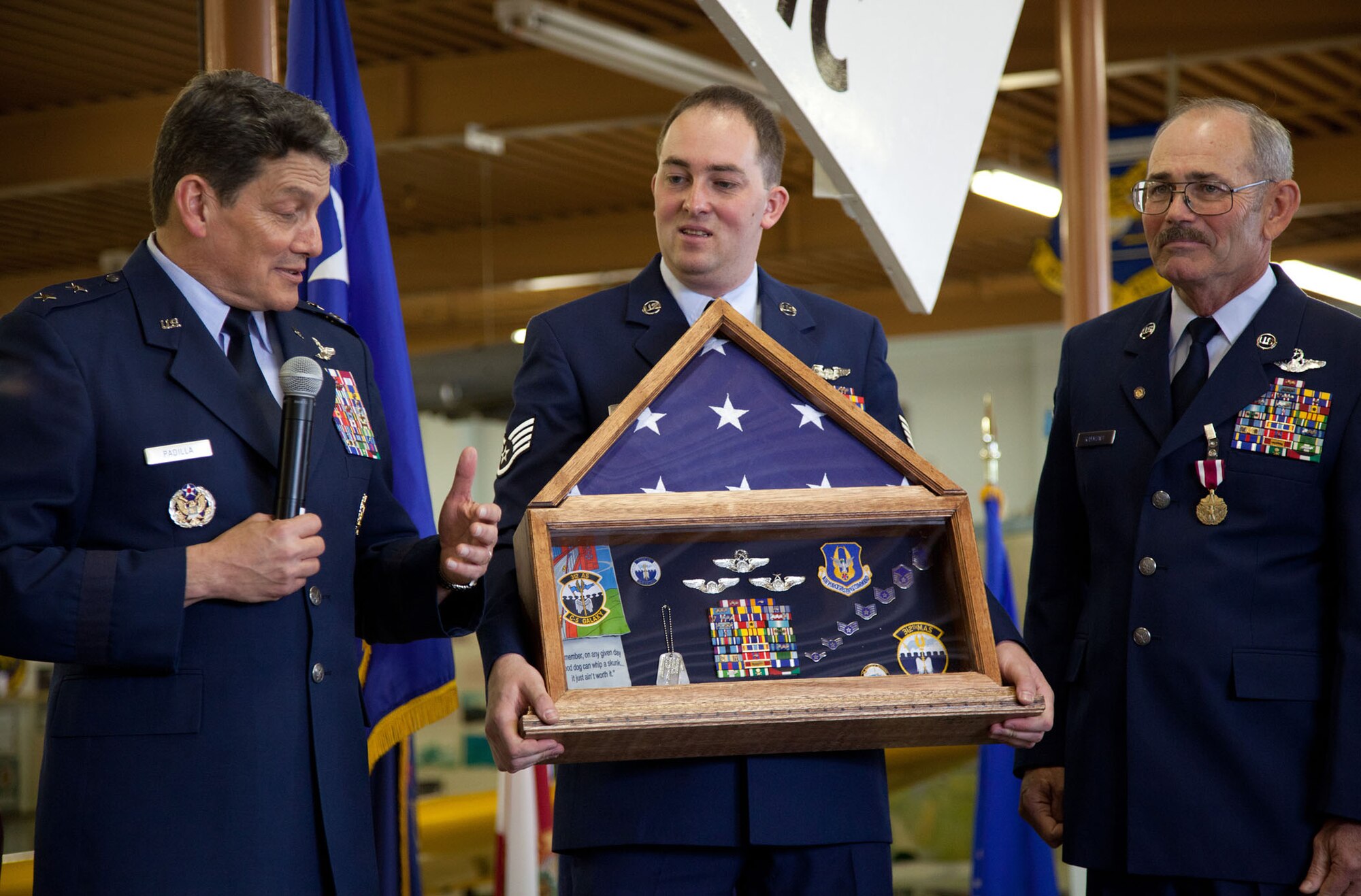 TRAVIS AIR FORCE BASE, Calif. -- Family and friends of Senior Master Sgt. David Raymond celebrate his 40 years of service in the U.S. Air Force Reserve at a retirement ceremony at Travis Air Force Base, Calif., April 11, 2012. Maj. Gen. Frank J. Padilla, Deputy Inspector General of the Air Force, presided over the ceremony honoring Raymond’s legacy as a C-5 Galaxy flight engineer with the 312th Airlift Squadron, 349th Air Mobility Wing.  Raymond began his military career as a C-141 loadmaster at Travis AFB during the Vietnam War. (U.S. Air Force photo / Lt. Col. Robert Couse-Baker)

