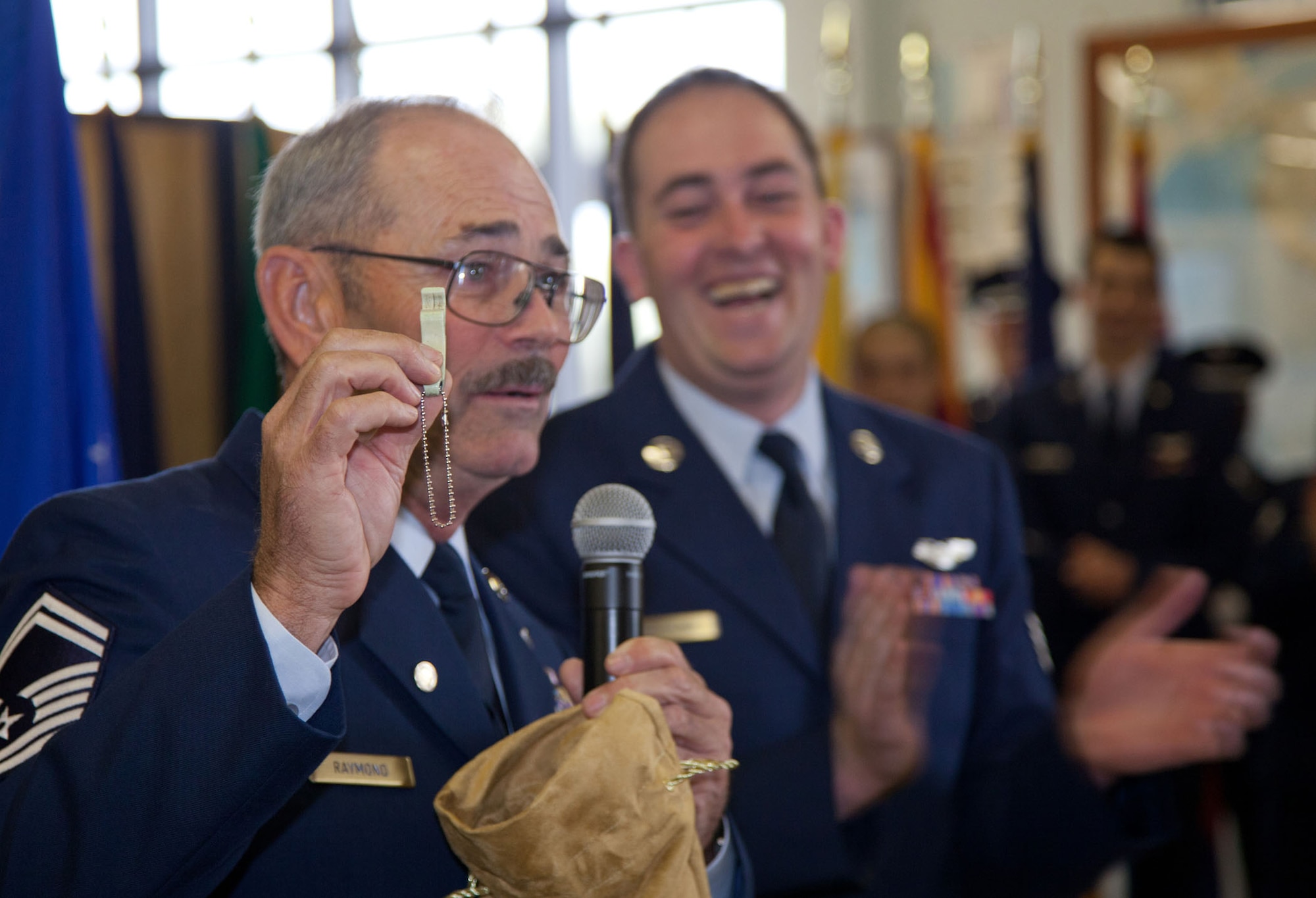 TRAVIS AIR FORCE BASE, Calif. -- Family and friends of Senior Master Sgt. David Raymond celebrate his 40 years of service in the U.S. Air Force Reserve at a retirement ceremony at Travis Air Force Base, Calif., April 11, 2012. Maj. Gen. Frank J. Padilla, Deputy Inspector General of the Air Force, presided over the ceremony honoring Raymond’s legacy as a C-5 Galaxy flight engineer with the 312th Airlift Squadron, 349th Air Mobility Wing.  Raymond began his military career as a C-141 loadmaster at Travis AFB during the Vietnam War. (U.S. Air Force photo / Lt. Col. Robert Couse-Baker)
