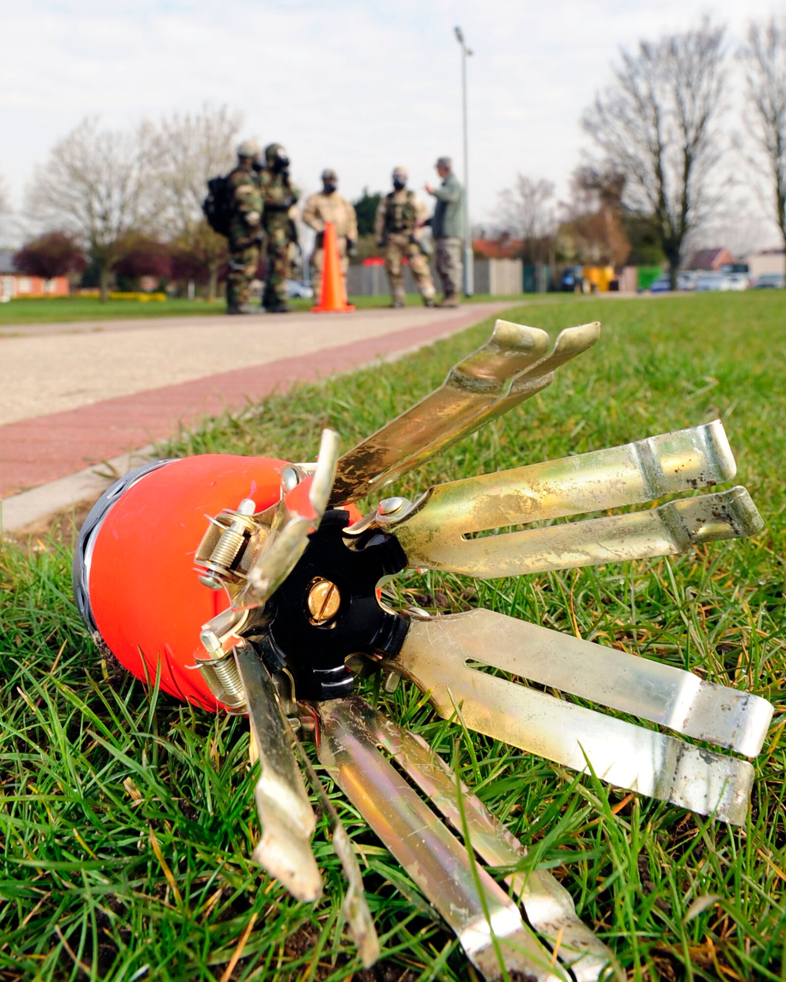 RAF MILDENHALL, England - A simulated unidentified explosive device placed by Chemical, Biological, Radiological and Nuclear training instructors is used during a post attack reconnaissance route exercise here April 12, 2012. The class teaches basic concepts and procedures vital during a CBRN attack including how to operate and report any explosives, damage, contamination or casualties found. (U.S. Air Force photo/Senior Airman Ethan Morgan)