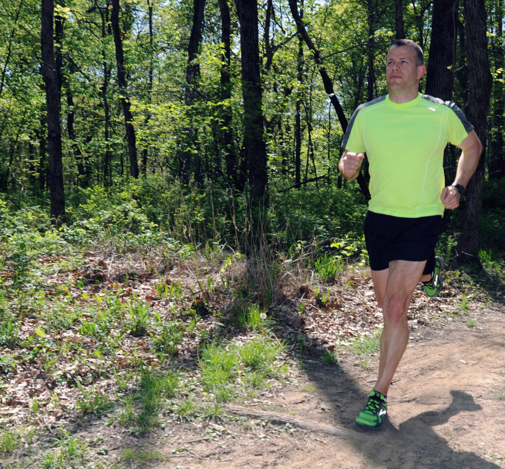 Craig Burton, 442nd Fighter Wing Command Post, runs on a trail in Knob Noster State Park. Through running and bicycling, Burton has lost close to 50 pounds in his efforts to be fit-to-fight. The 442nd FW is an A-10 Thunderbolt II Air Force Reserve unit at Whiteman Air Force Base, Mo.