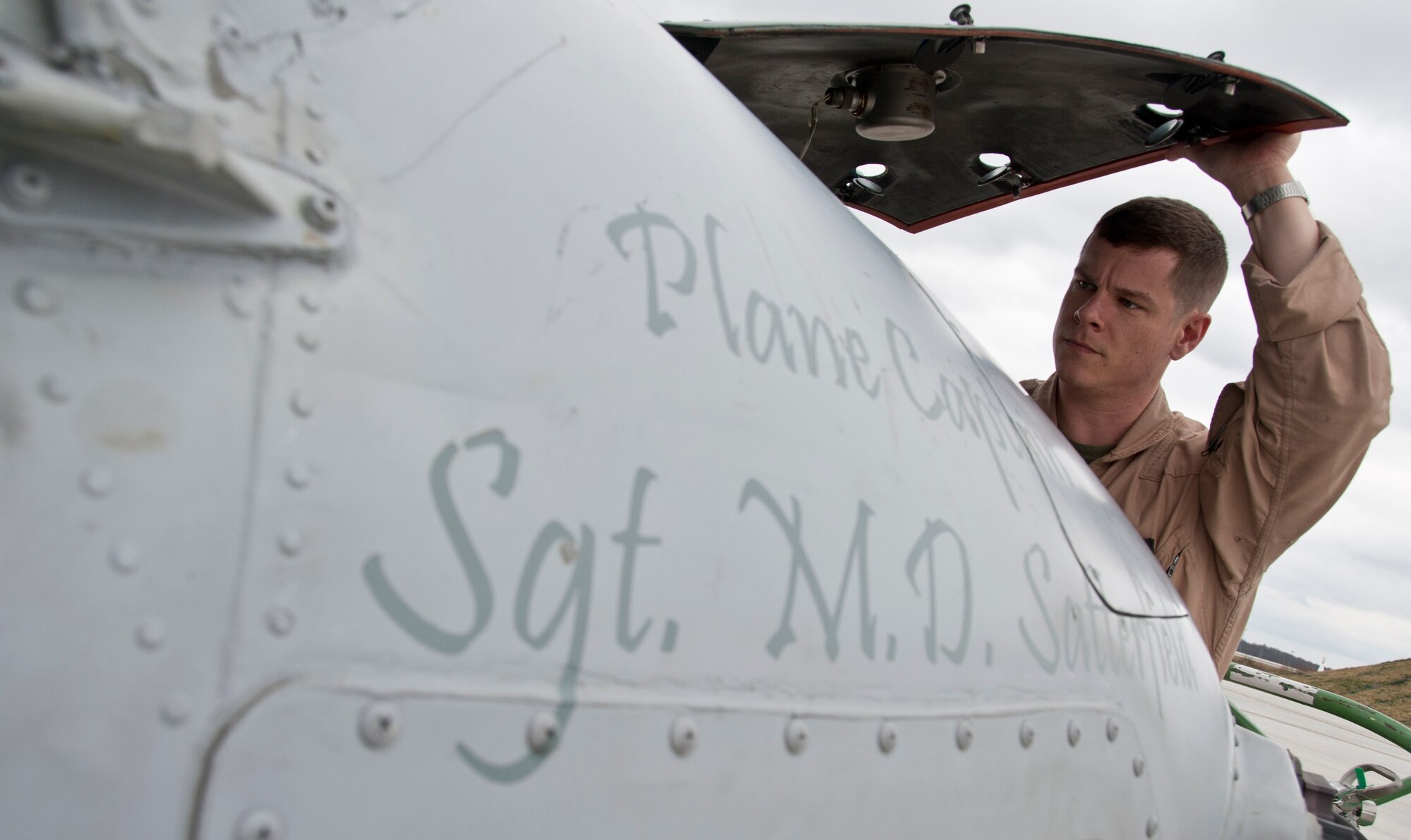 Captain Danny Byrd, UH-1N Iroquois co-pilot, performs preflight checks on the aircraft before takeoff March 21. Byrd is a member of the Marine Helicopter Light Attack 773, which moved to Joint Base McGuire-Dix-Lakehurst from Johnstown, Pa. (U.S. Air Force photo by Staff Sgt. David Carbajal/Released)