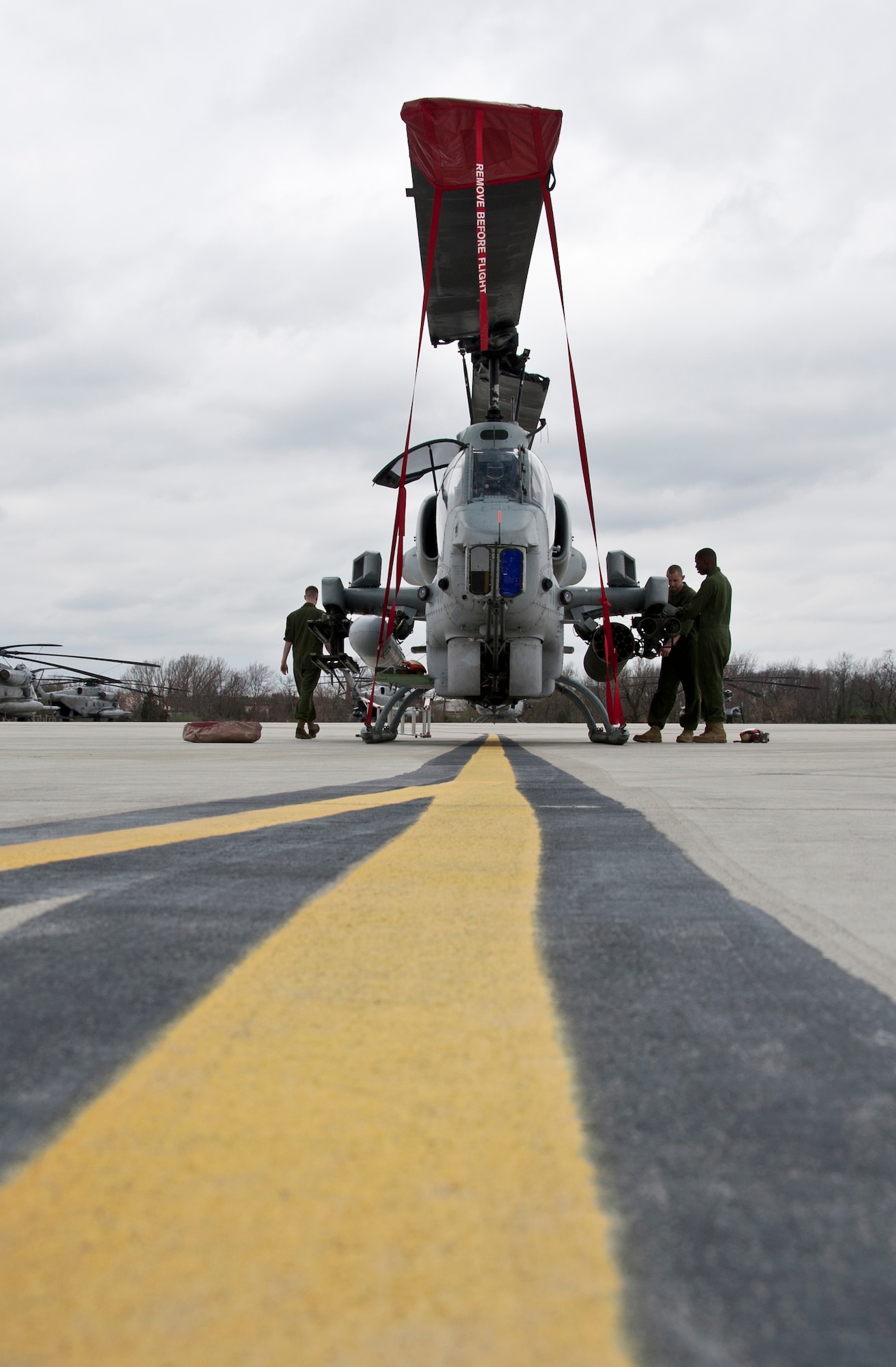 Marines from Marine Helicopter Light Attack 773 prepare an AH-1W Super Cobra for flight March 21. The HMLA-773 came over from Johnstown, Pa., and the squadron's mission is to provide support to Marine unit's in deployed locations. (U.S. Air Force photo by Staff Sgt. David Carbajal/Released)